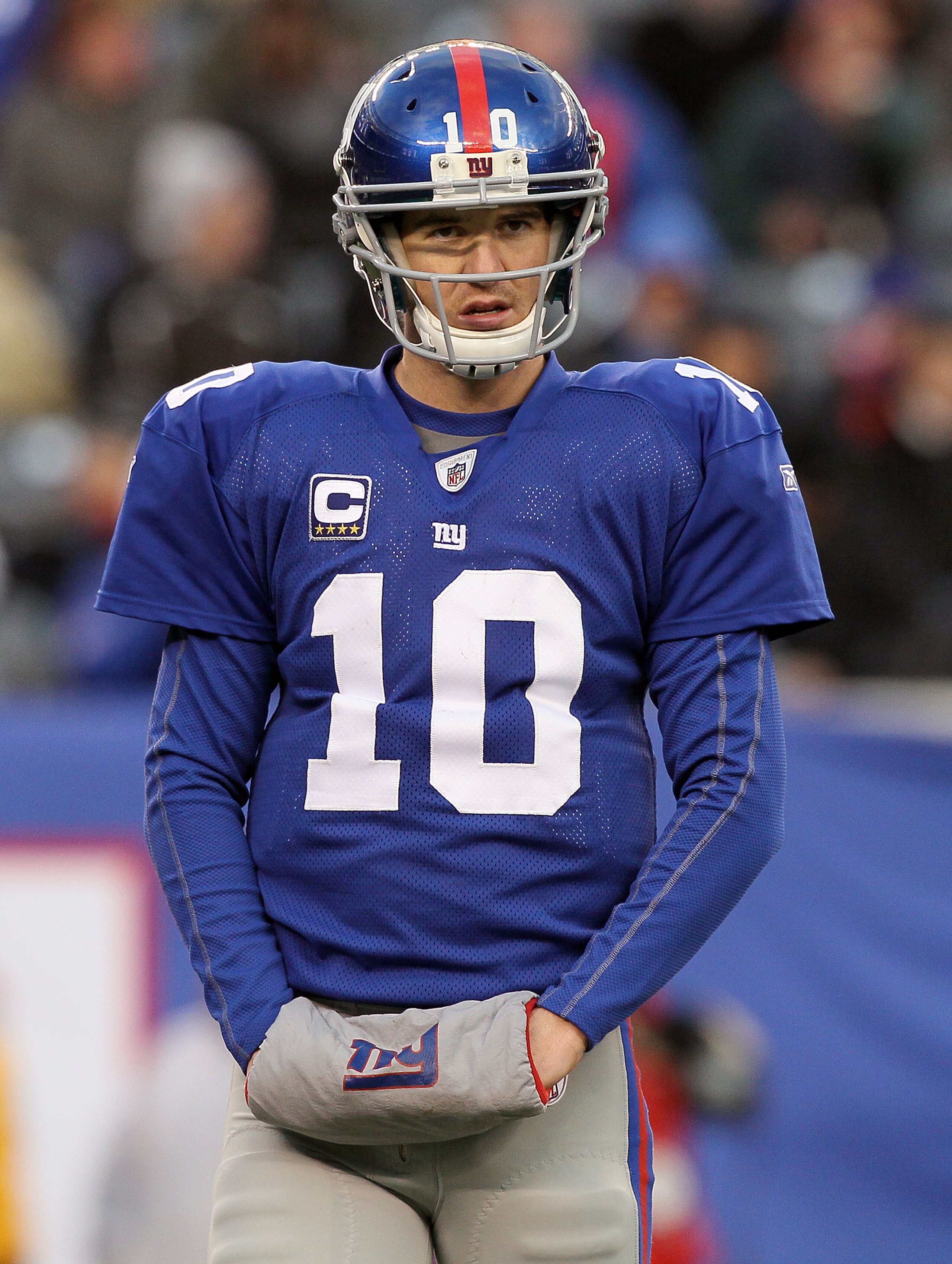 EAST RUTHERFORD, NJ - DECEMBER 05:  Eli Manning #10 of the New York Giants looks on against the Washington Redskins on December 5, 2010 at the New Meadowlands Stadium in East Rutherford, New Jersey. The Giants defeated the Redskins 31-7.  (Photo by Jim Mc