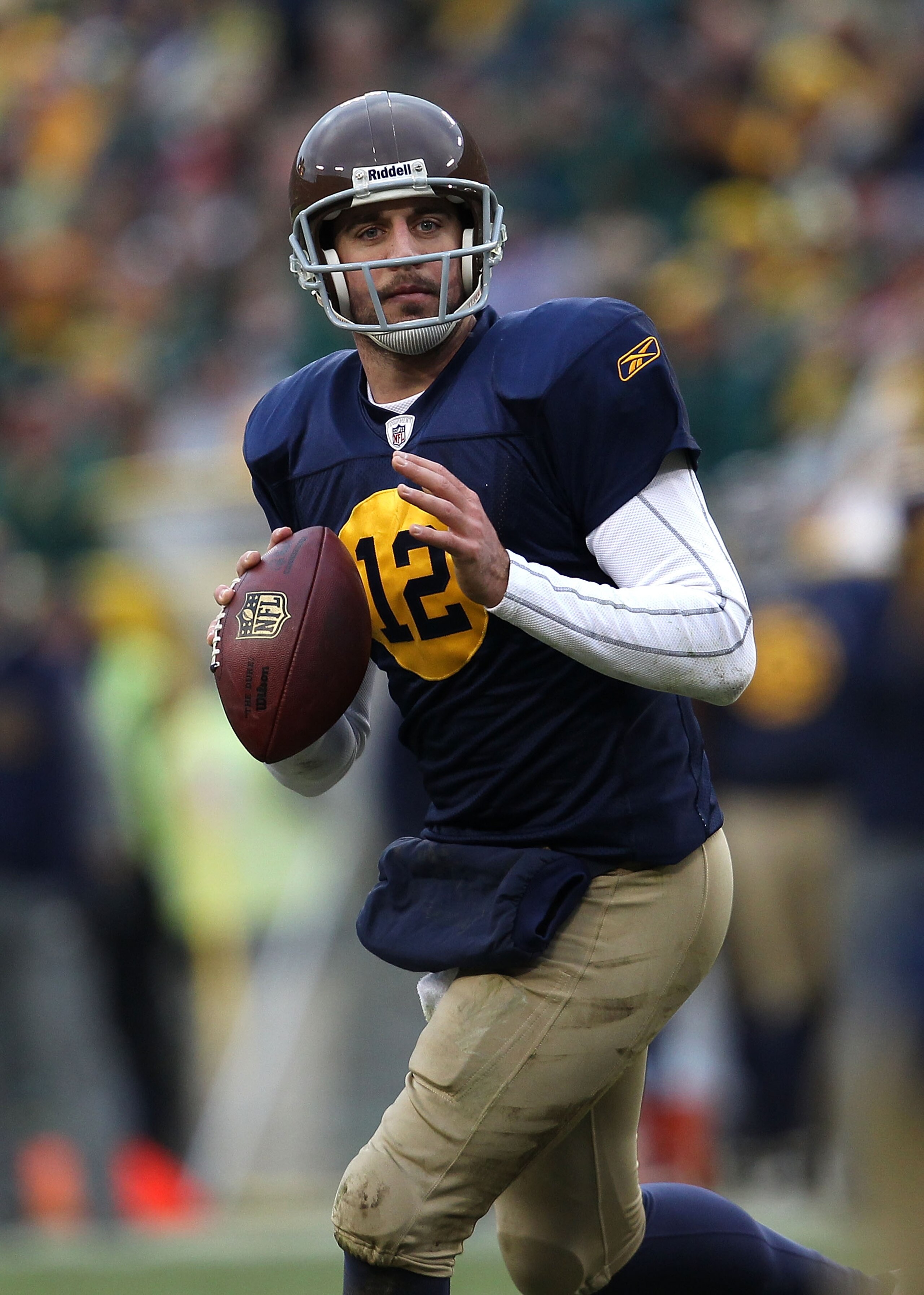 GREEN BAY, WI - DECEMBER 05:  Aaron Rodgers #12 of the Green Bay Packers looks for a receiver against the San Francisco 49ers at Lambeau Field on December 5, 2010 in Green Bay, Wisconsin. The Packers defeated the 49ers 34-16. (Photo by Jonathan Daniel/Get