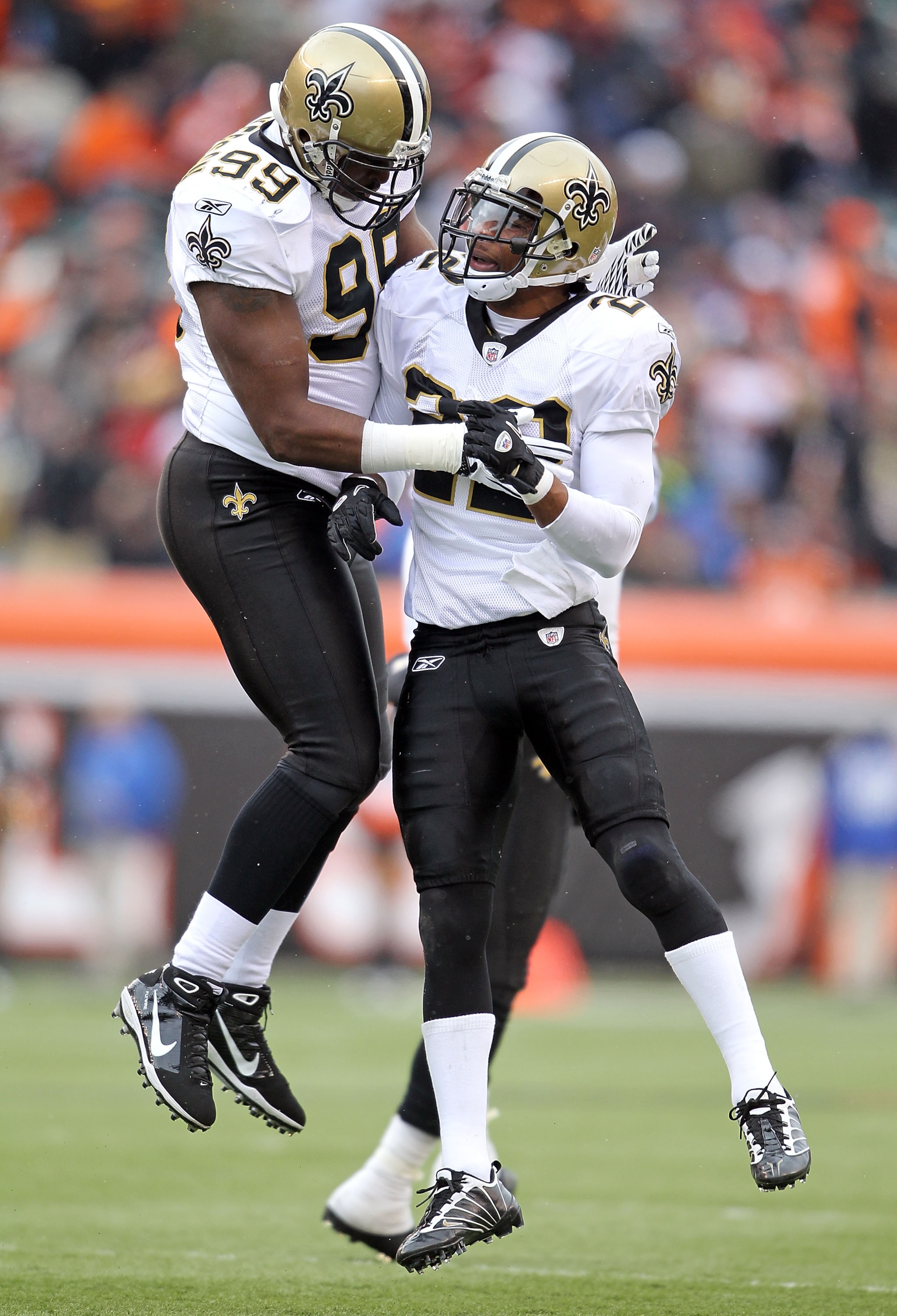 CINCINNATI, OH - DECEMBER 05:  Jimmy Wilkerson #99 and Tracy Porter #22 of the New Orleans Saints celebrate stopping the Cincinnati Bengals on fourth down during the NFL game at Paul Brown Stadium on December 5, 2010 in Cincinnati, Ohio. The Saints won 34