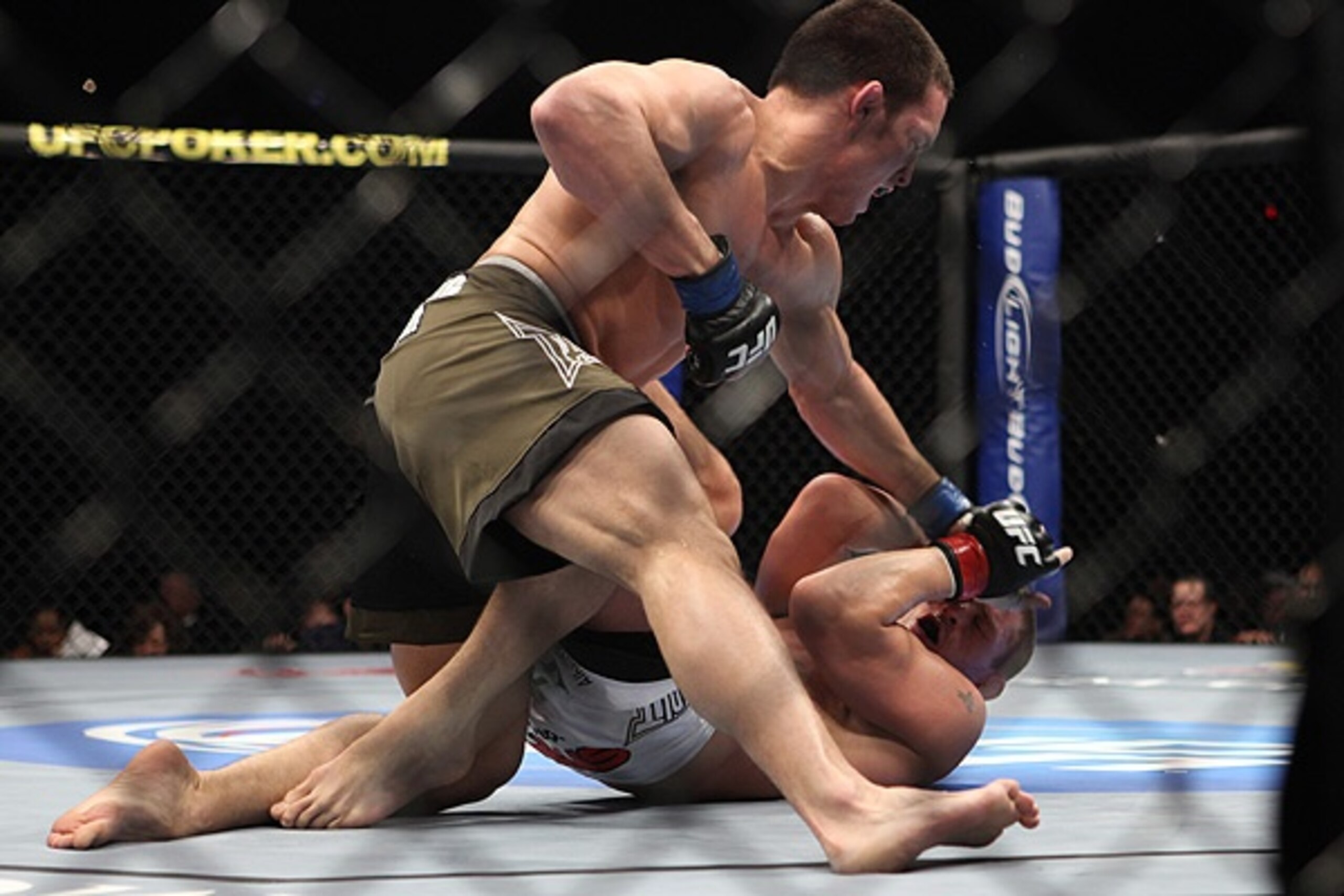 Jake Ellenberger delivering thunderous rights onto Mike Pyle