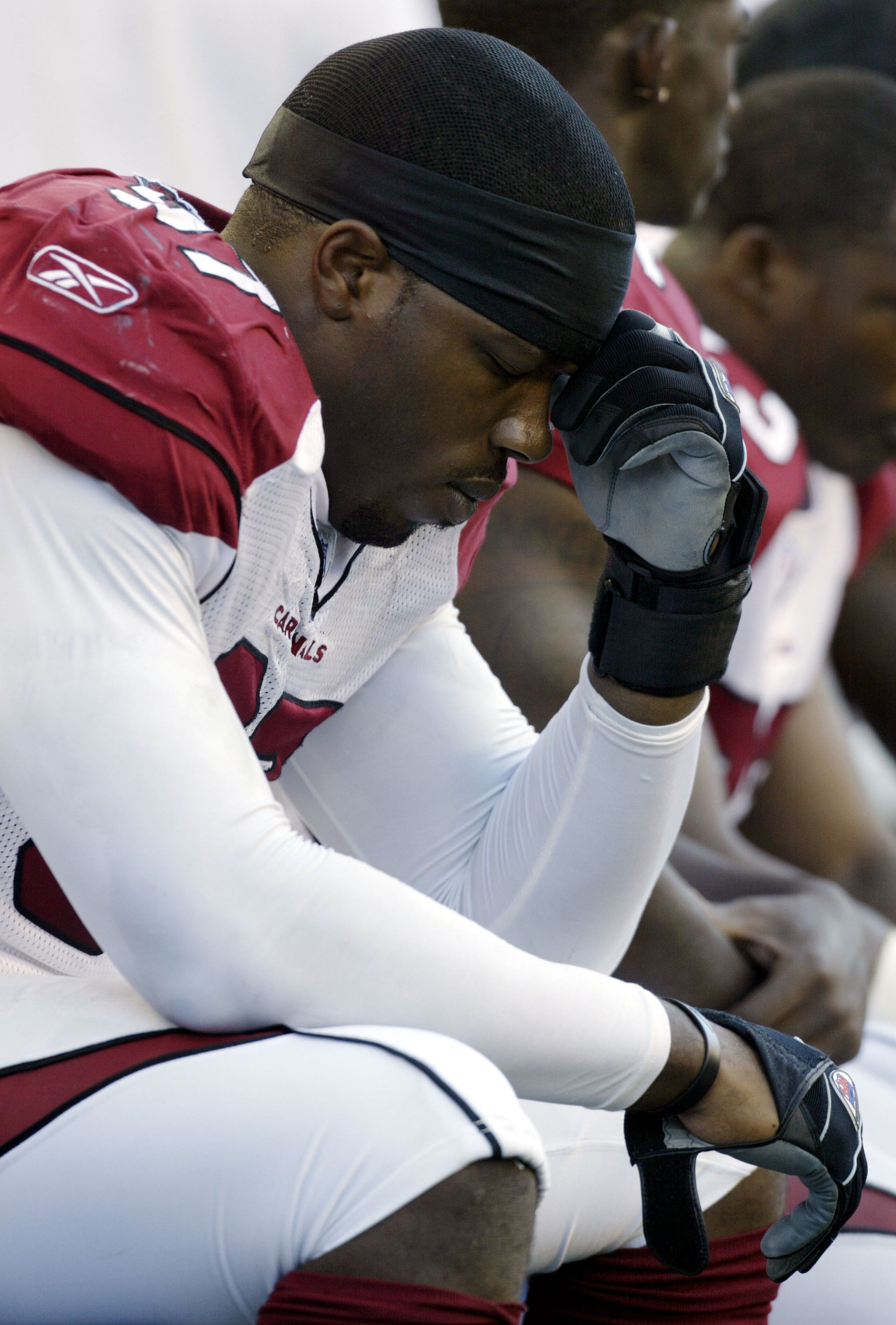 SEATTLE - SEPTEMBER 25: Defensive end Calvin Pace #13 of the Arizona Cardinals sits on the sideline late in the fourth quarter of the Cardinals' 37-12 loss to the Seattle Seahawks at Qwest Field on September 25, 2005 in Seattle, Washington. (Photo by Ot SEATTLE - SEPTEMBER 25: Defensive end Calvin Pace #13 of the Arizona Cardinals sits on the sideline late in the fourth quarter of the Cardinals' 37-12 loss to the Seattle Seahawks at Qwest Field on September 25, 2005 in Seattle, Washington. (Photo by Ot