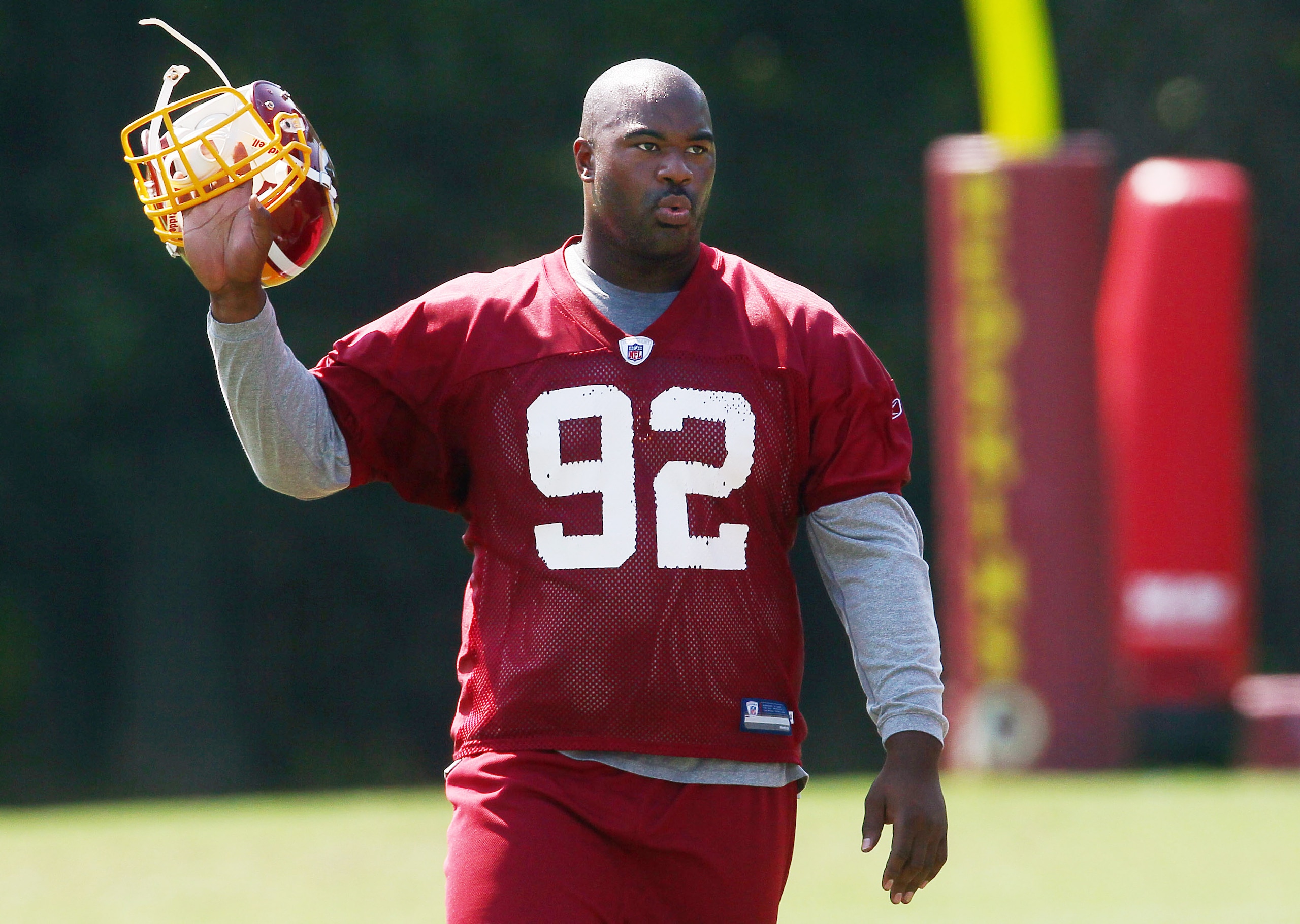 ASHBURN, VA - AUGUST 06:  Defensive lineman Albert Haynesworth #92 of the Washington Redskins walks off the field after missing his eighth consecutive day of practice during Redskins training camp on August 6, 2010 in Ashburn, Virginia.  (Photo by Win McN
