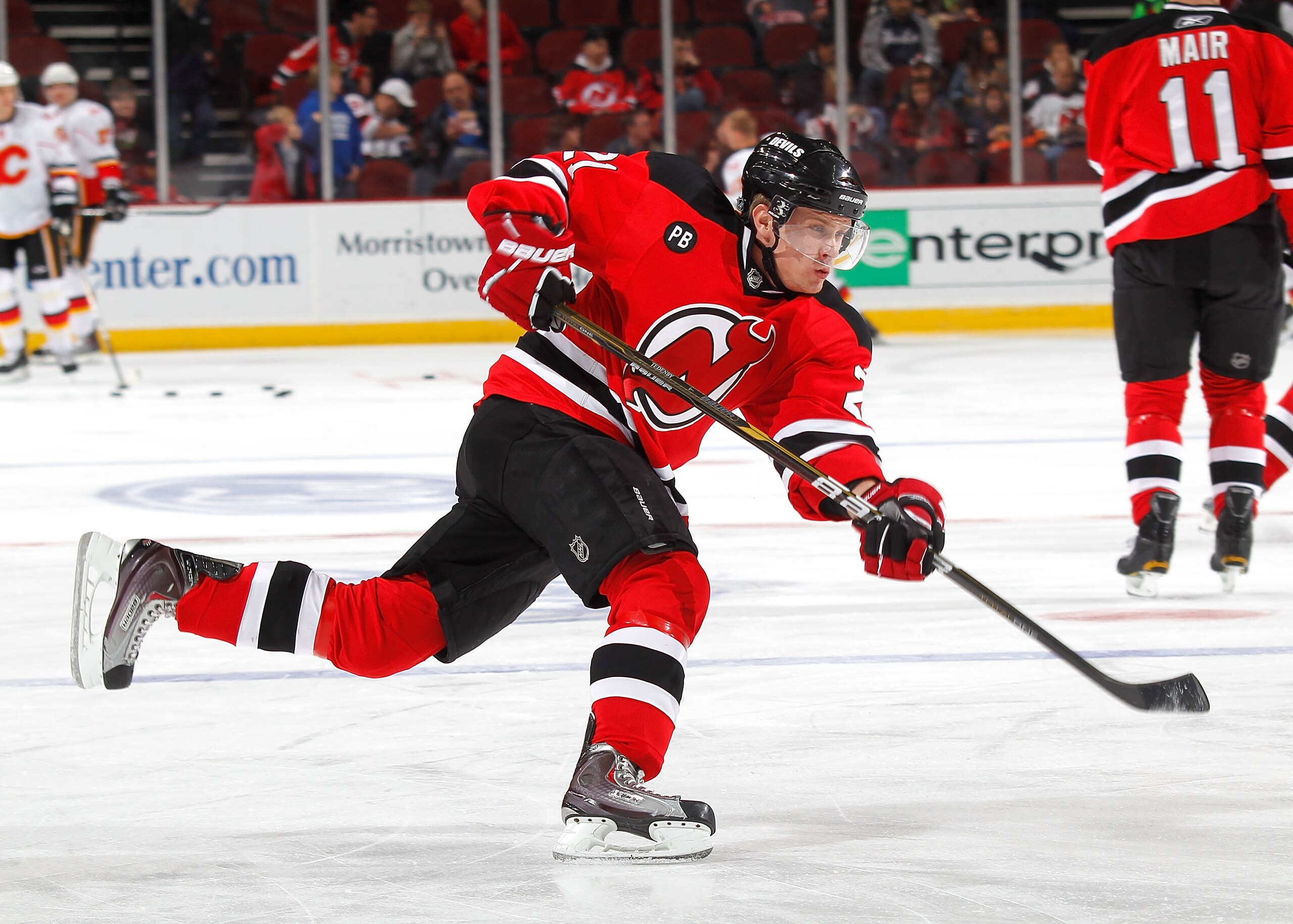 NEWARK, NJ - NOVEMBER 24:   Mattias Tedenby #21 of the New Jersey Devils shoots during warmups before a hockey game against the Calgary Flames at the Prudential Center on November 24, 2010 in Newark, New Jersey.  (Photo by Paul Bereswill/Getty Images)