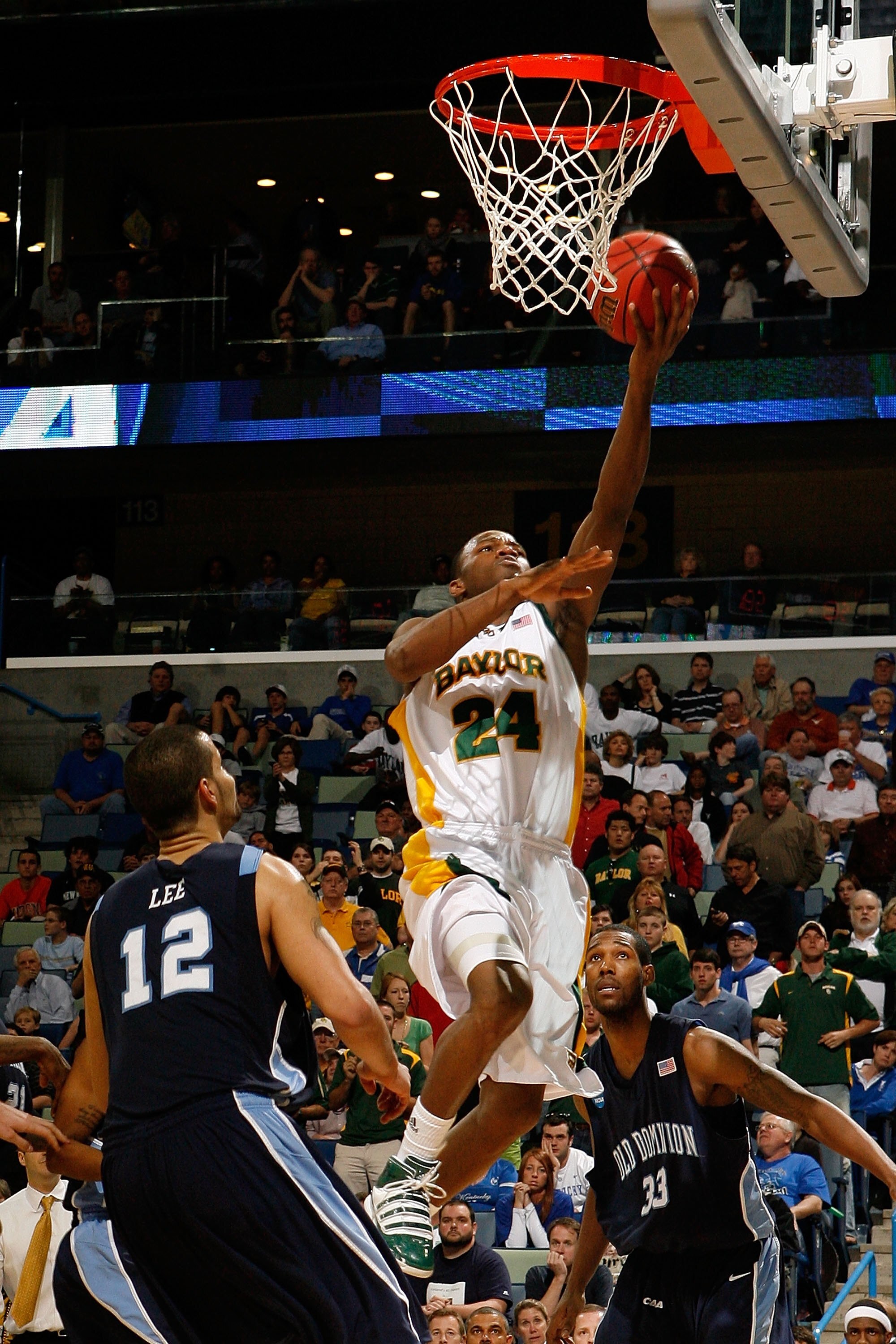 NEW ORLEANS - MARCH 20:  LaceDarius Dunn #24 of the Baylor Bears shoots the ball over Gerald Lee #12  of the Old Dominion University Monarchs during the second round of the 2010 NCAA men's basketball tournament at the New Orleans Arena on March 20, 2010 i
