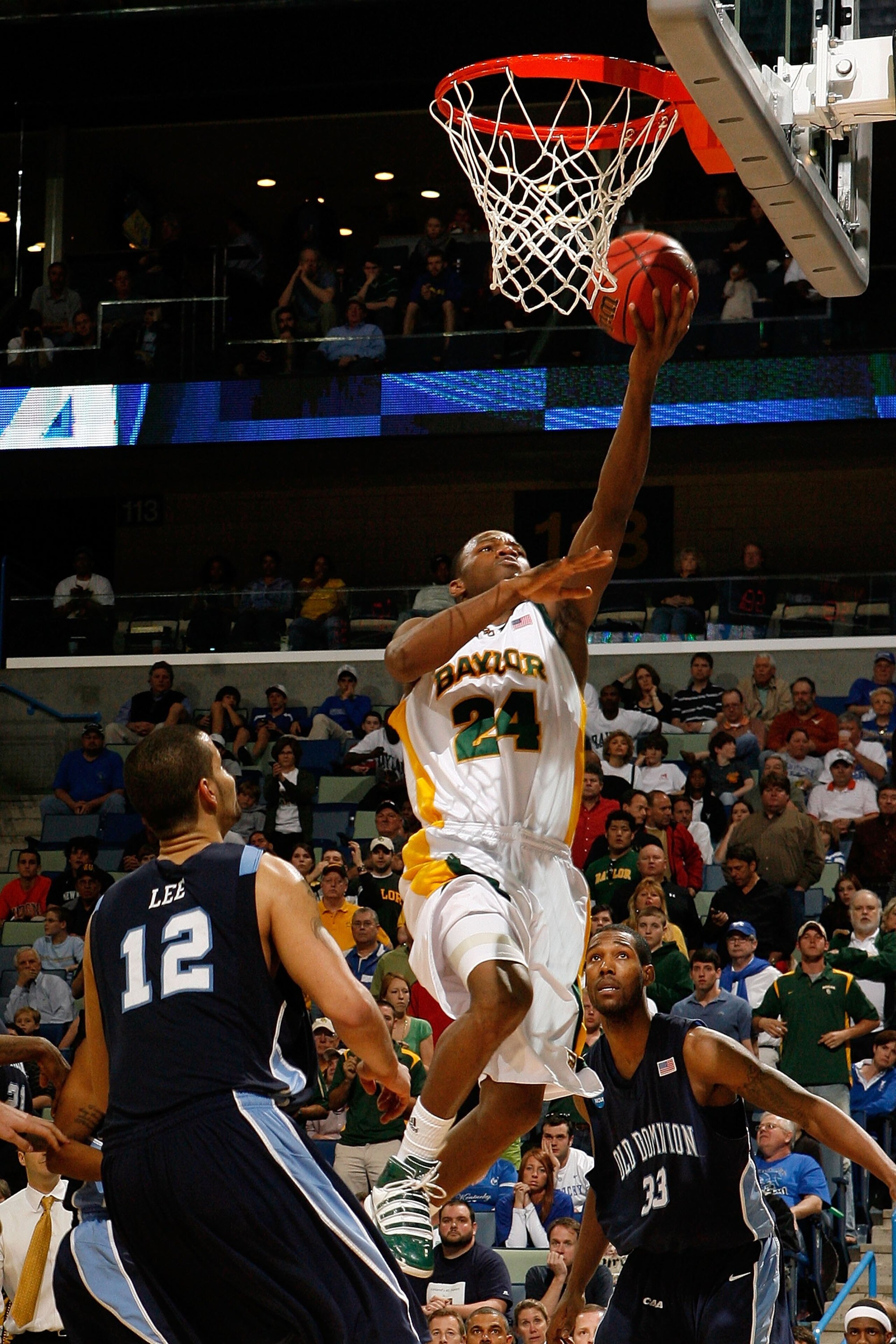 NEW ORLEANS - MARCH 20:  LaceDarius Dunn #24 of the Baylor Bears shoots the ball over Gerald Lee #12  of the Old Dominion University Monarchs during the second round of the 2010 NCAA men's basketball tournament at the New Orleans Arena on March 20, 2010 i