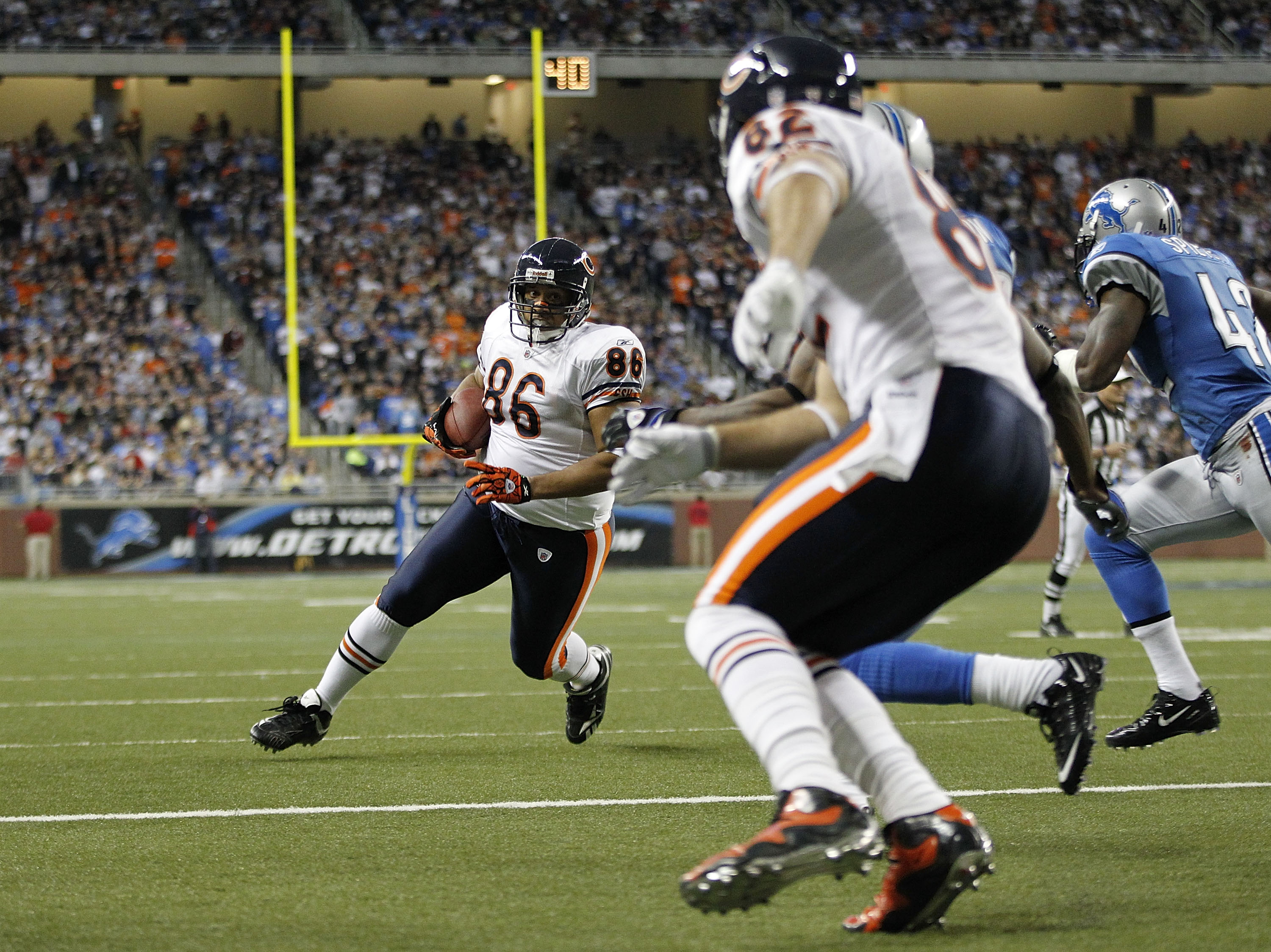 DETROIT - DECEMBER 05:  Brandon Manumaleuna #86 of the Chicago Bears runs for a fourth quarter touchdown as Greg Olsen #82 blocks during the game against the Detroit Lions at Ford Field on December 5, 2010 in Detroit, Michigan. The Bears defeated the Lion