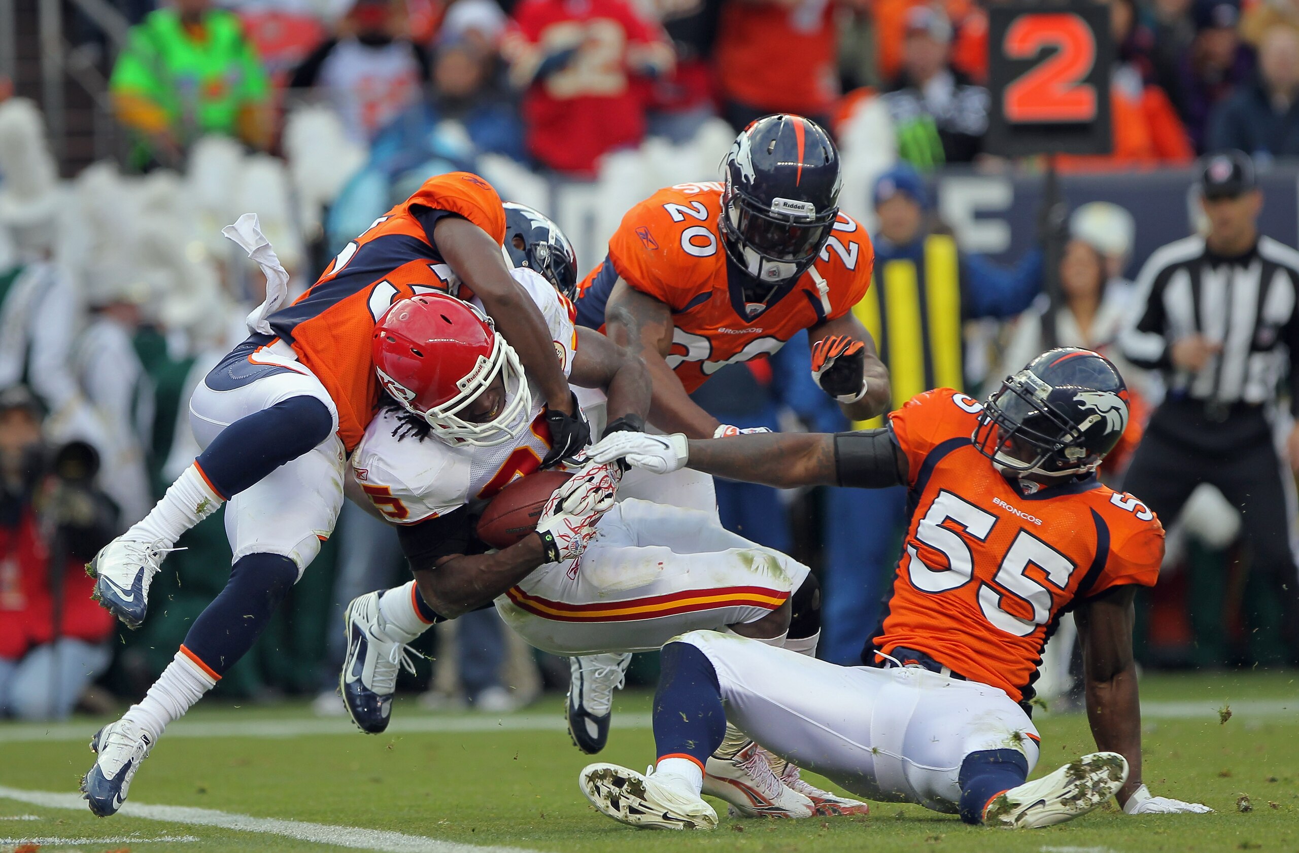 DENVER - NOVEMBER 14:  Running back Jamaal Charles #25 of the Kansas City Chiefs fights his way into the endzone on a five yard reception against the defense of Nate Jones #33, Brian Dawkins #20 and DJ Williams #55 of the Denver Bronco in the second quart