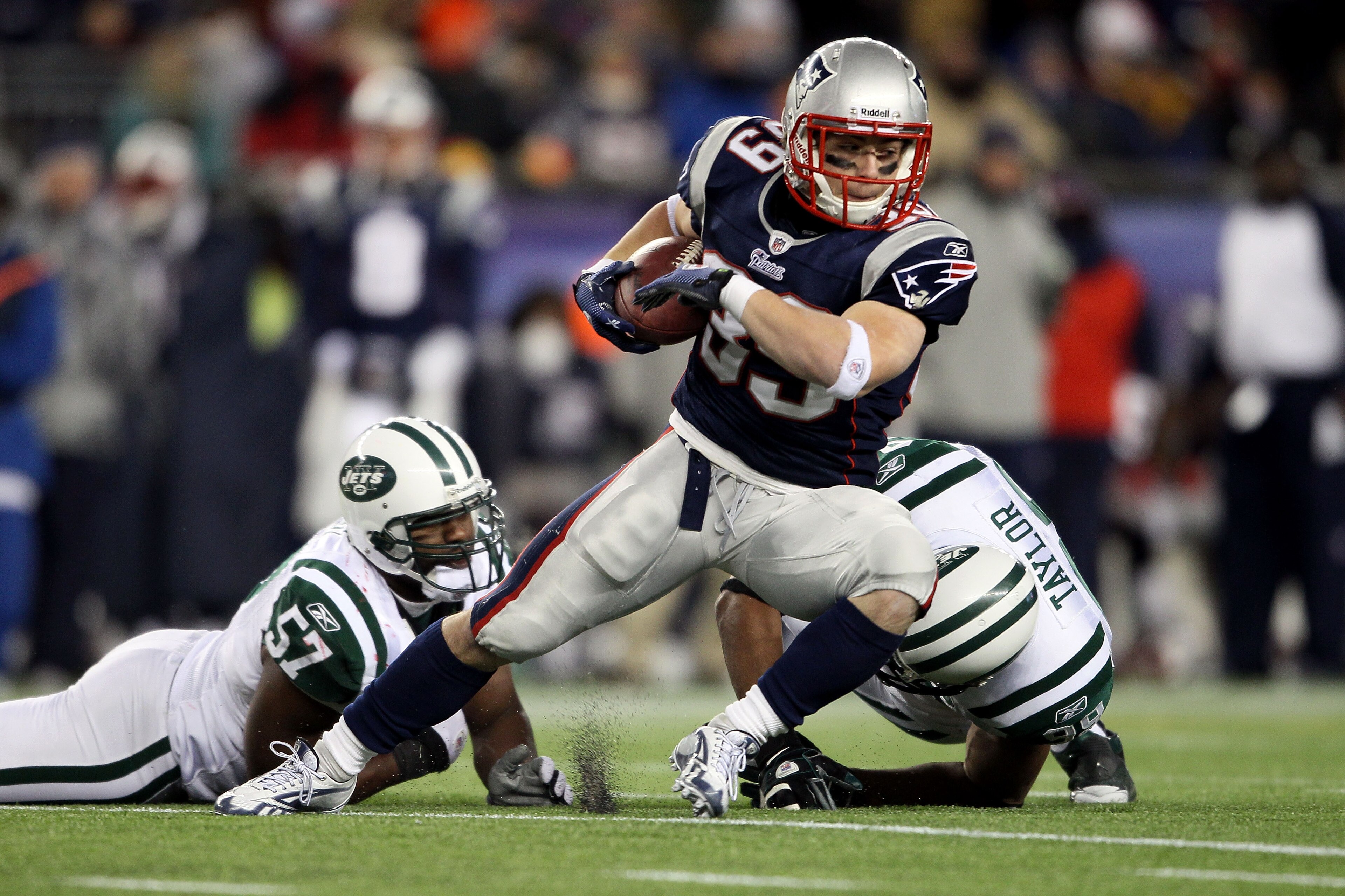 FOXBORO, MA - DECEMBER 06: Danny Woodhead #39 of the New England Patriots runs with the ball against Bart Scott #57 and Jason Taylor #99 of the New York Jets at Gillette Stadium on December 6, 2010 in Foxboro, Massachusetts. (Photo by Elsa/Getty Images) FOXBORO, MA - DECEMBER 06: Danny Woodhead #39 of the New England Patriots runs with the ball against Bart Scott #57 and Jason Taylor #99 of the New York Jets at Gillette Stadium on December 6, 2010 in Foxboro, Massachusetts. (Photo by Elsa/Getty Images)