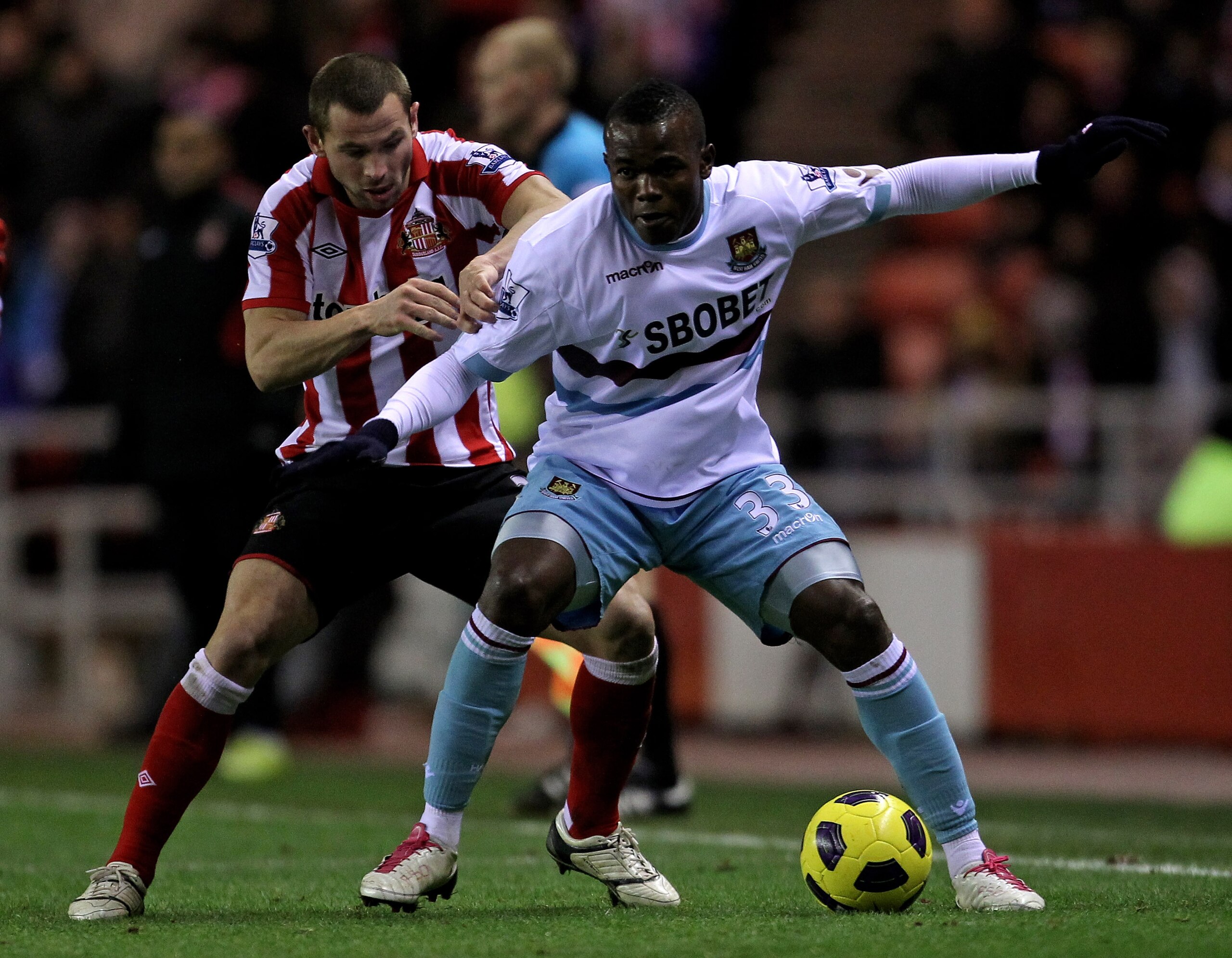 SUNDERLAND, ENGLAND - DECEMBER 05:  Victor Obinna of West Ham United competes for the ball with Phil Bardsley of Sunderland during the Barclays Premier League match between Sunderland and West Ham United at the Stadium of Light on December 5, 2010 in Sund