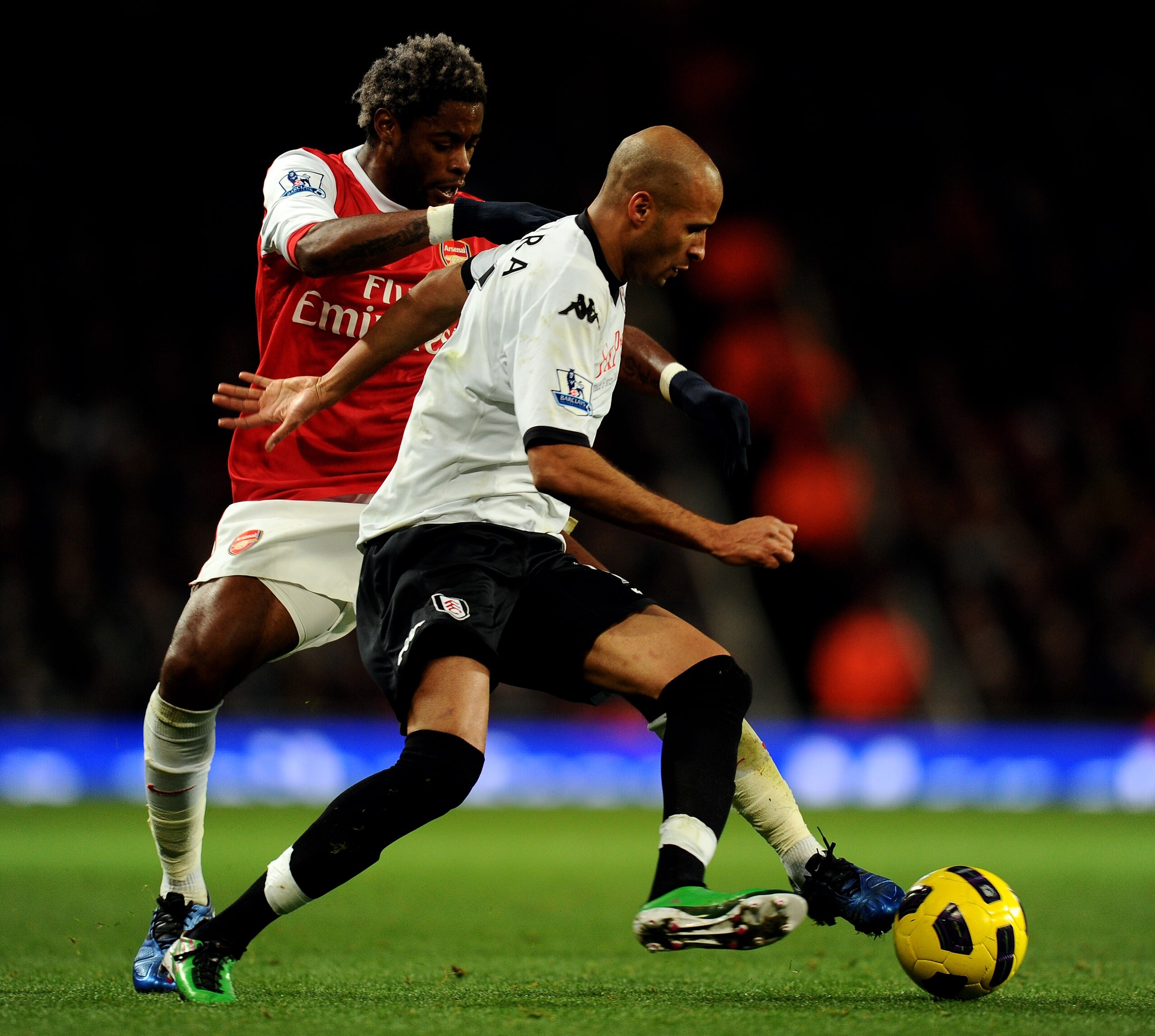 LONDON, ENGLAND - DECEMBER 04:  Alex Song (L) of Arsenal tackles Diomansy Kamara of Fulham during the Barclays Premier League match between Arsenal and Fulham at the Emirates Stadium on December 4, 2010 in London, England.  (Photo by Mike Hewitt/Getty Ima