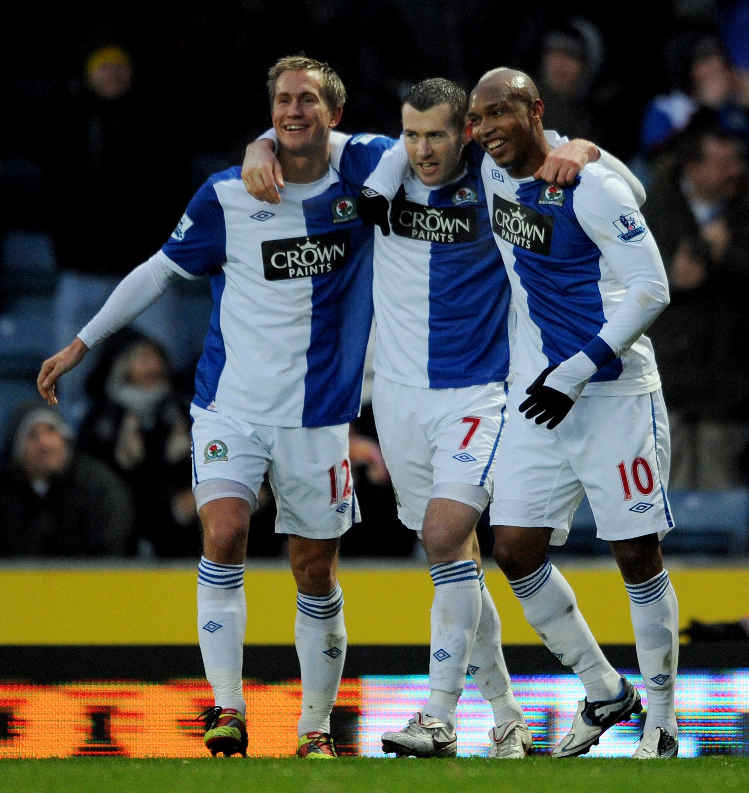 BLACKBURN, ENGLAND - DECEMBER 04:  Brett Emerton of Blackburn Rovers is congratulated by team-mates Morten Gamst-Pedersen and El Hadji Diouf after scoring his side's second goal during the Barclays Premier League match between Blackburn Rovers and Wolverh