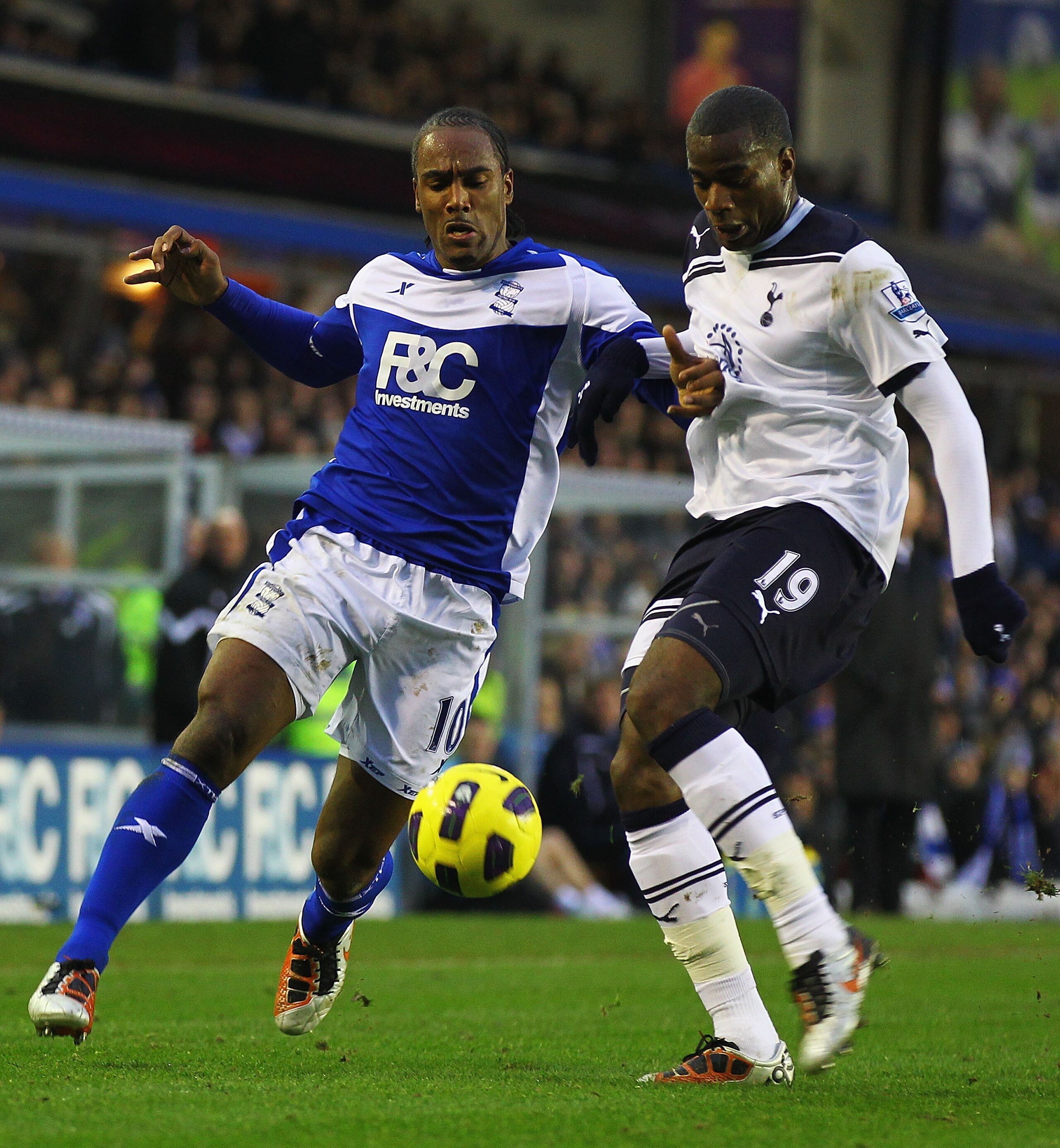 BIRMINGHAM, ENGLAND - DECEMBER 04:  Cameron Jerome of Birmingham and Sebastien Bassong of Tottenham challenge for the ball during the Barclays Premier League match between Birmingham City and Tottenham Hotspur at St Andrews on December 4, 2010 in Birmingh