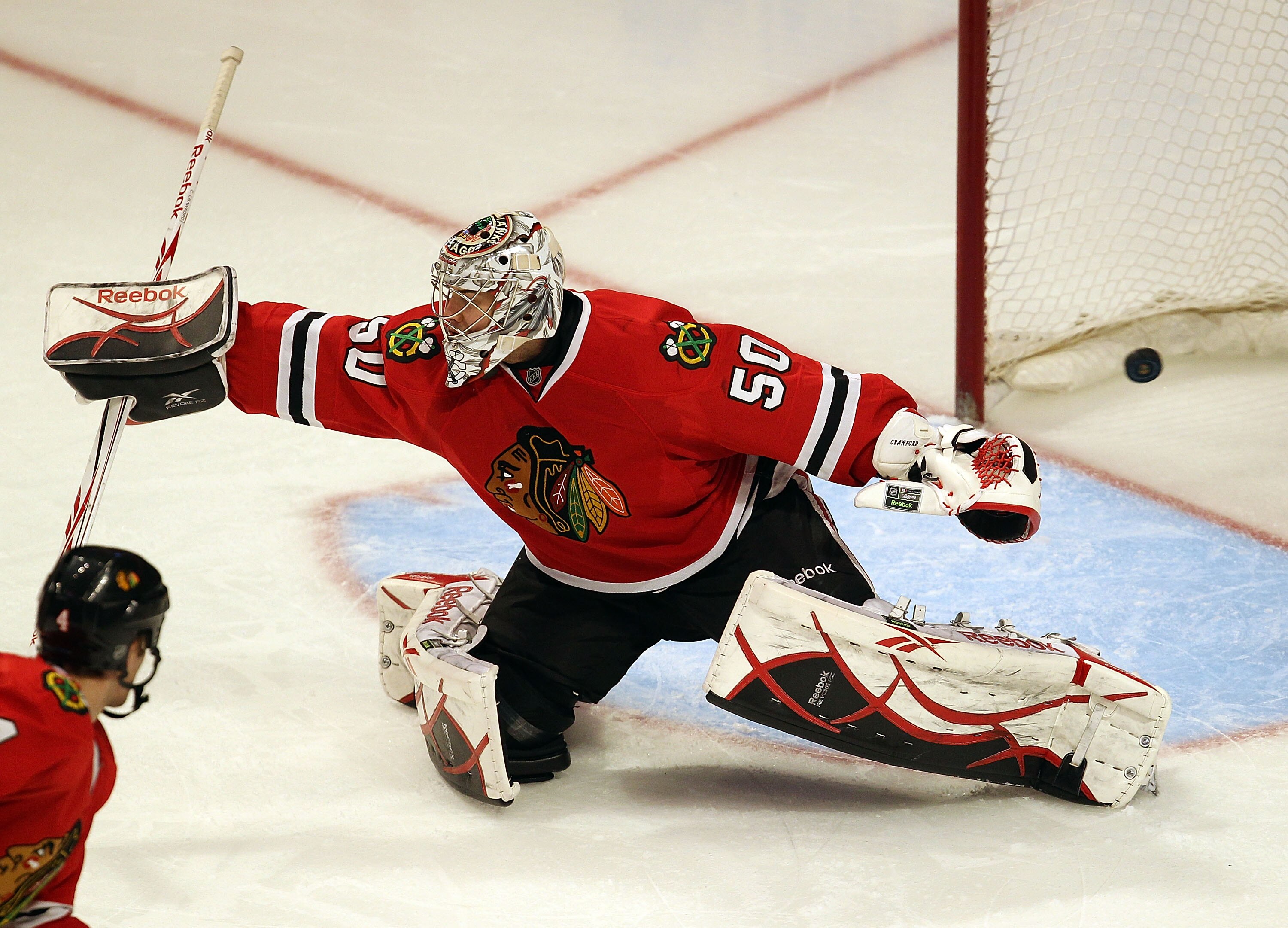 CHICAGO - NOVEMBER 30: Corey Crawford #50 of the Chicago Blackhawks lets a shot by Alex Pietrangelo of the St. Louis Blues slip past for a 3rd period goal at the United Center on November 30, 2010 in Chicago, Illinois. The Blackhawks defeated the Blues 7-