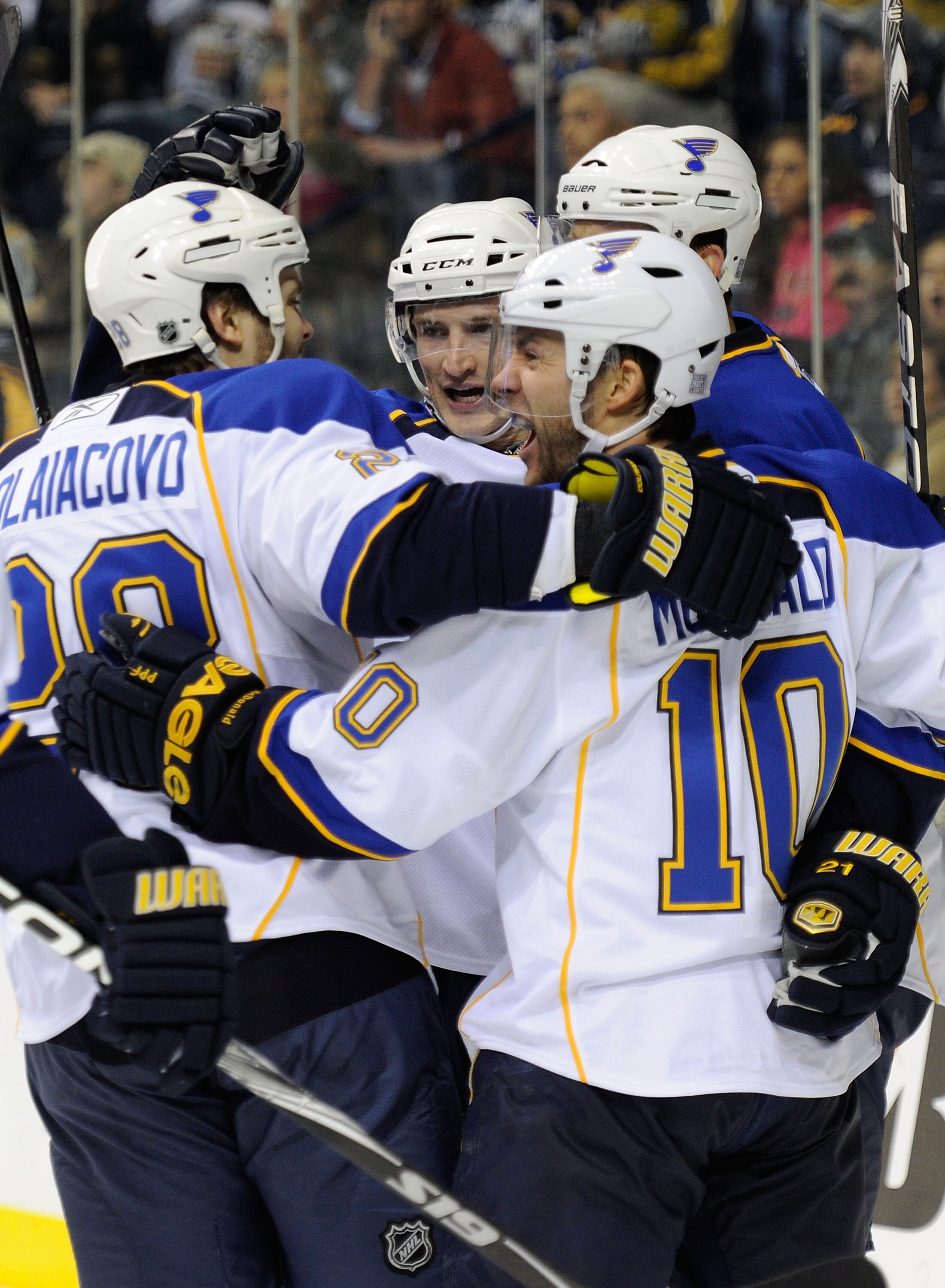 NASHVILLE, TN - OCTOBER 14:  Defenseman Carlo Colaiacovo #28 and center Andy McDonald #10 of the St. Louis Blues celebrate with teammates after a Blues goal against the Nashville Predators on October 14, 2010 in Nashville, Tennessee.  (Photo by Frederick