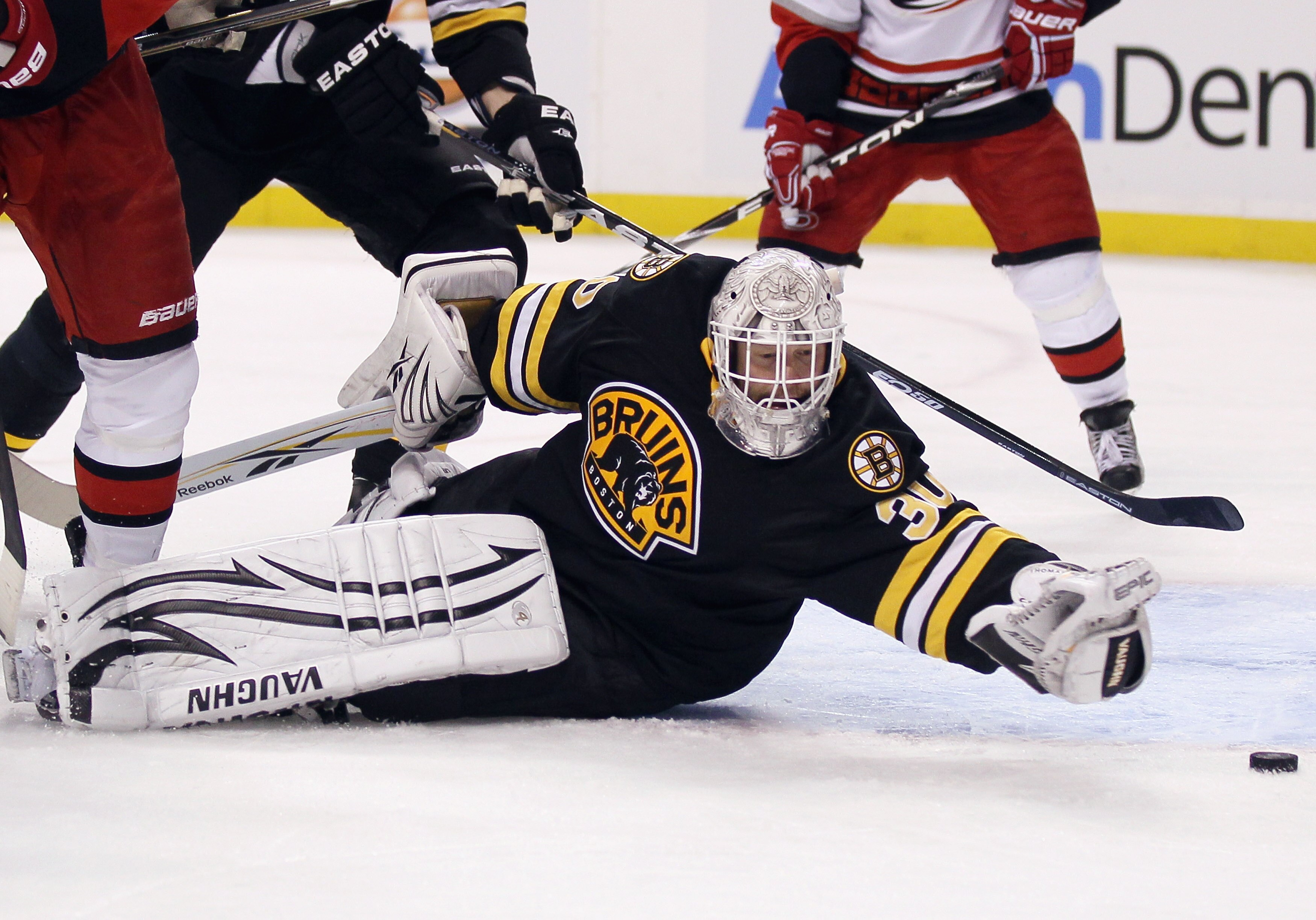 BOSTON - NOVEMBER 26:  Tim Thomas #30 of the Boston Bruins stops a shot in the second period against the Carolina Hurricanes on November 26, 2010 at the TD Garden in Boston, Massachusetts.  (Photo by Elsa/Getty Images)