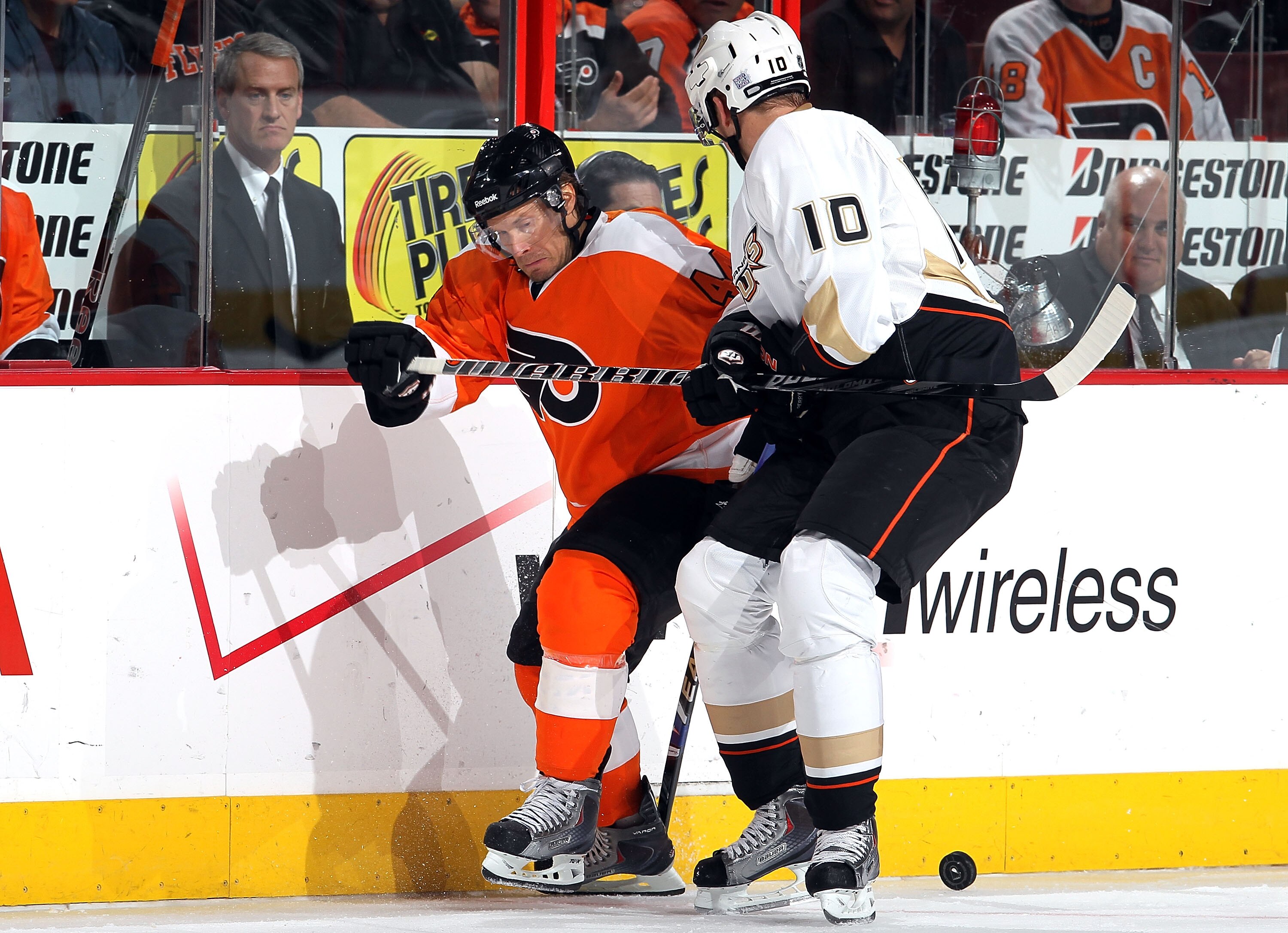PHILADELPHIA - OCTOBER 21:  Kimmo Timonen #44 of the Philadelphia Flyers plays the puck against Corey Perry #10 of the Anaheim Ducks on October 21, 2010 at Wells Fargo Center in Philadelphia, Pennsylvania. Anaheim defeated the Flyers 3-2.  (Photo by Jim M