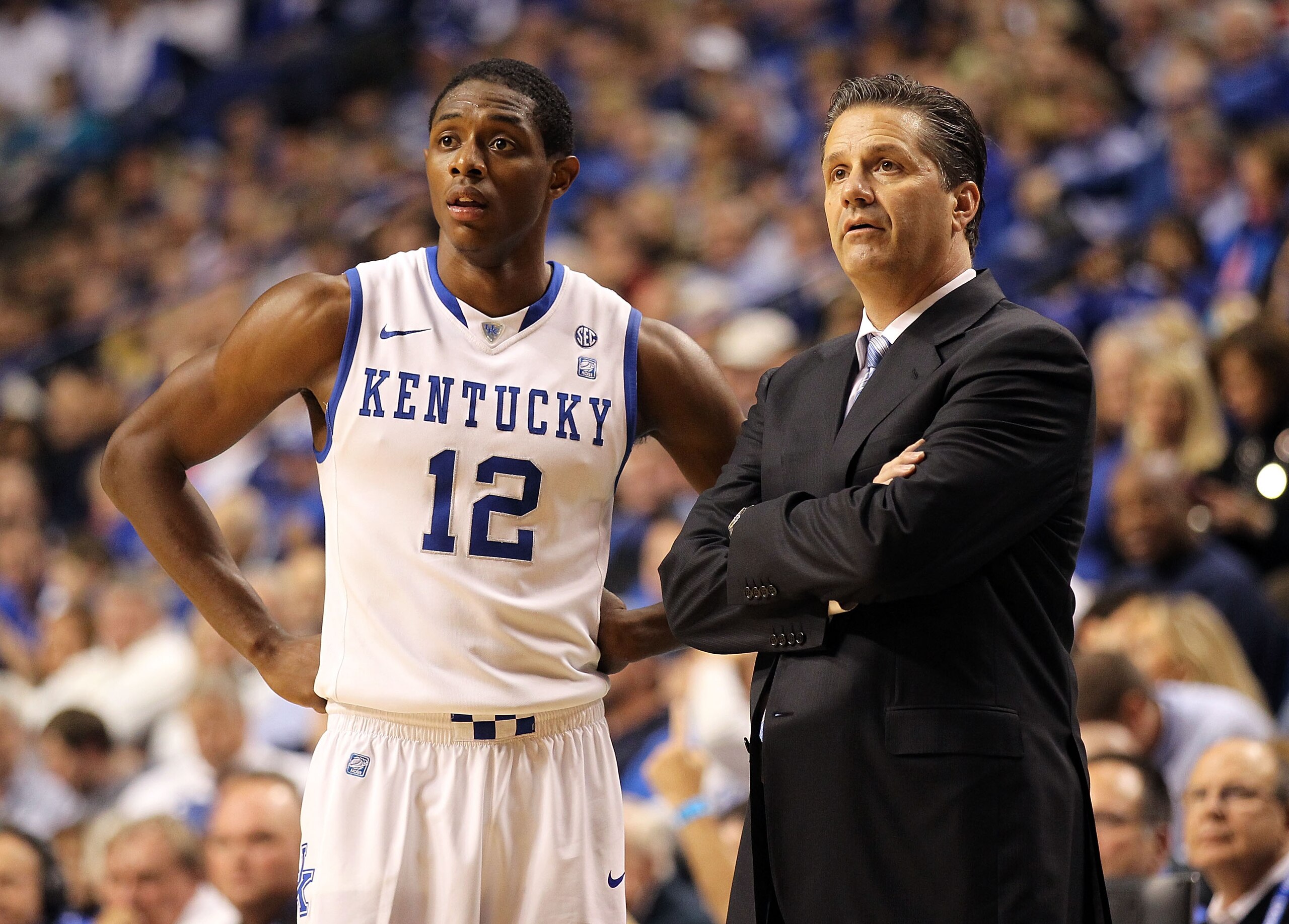 LEXINGTON, KY - NOVEMBER 30:  Brandon Knight #12 of the Kentucky Wildcats watches the game with Head Coach John Calipari during the game against the Boston University Terriers on November 30, 2010 in Lexington, Kentucky.  (Photo by Andy Lyons/Getty Images