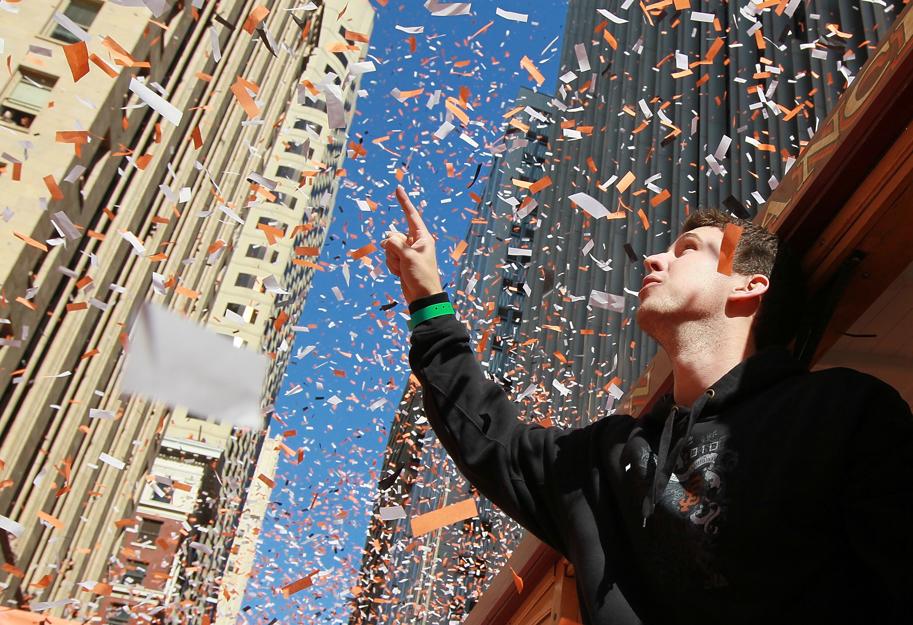 SAN FRANCISCO - NOVEMBER 03:  Buster Posey of the San Francisco Giants celebrates during the Giants' vicotry parade on November 3, 2010 in San Francisco, California. Thousands of Giants fans lined the streets of San Francisco to watch the San Francisco Gi