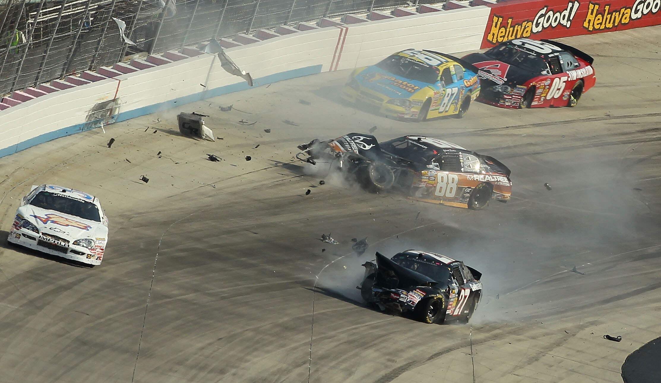 DOVER, DE - SEPTEMBER 25:  Elliott Sadler, driver of the #88 Realtree Outfitters Chevrolet, crashes after an incident in the NASCAR Nationwide Series Dover 200 at Dover International Speedway on September 25, 2010 in Dover, Delaware.  (Photo by Nick Laham