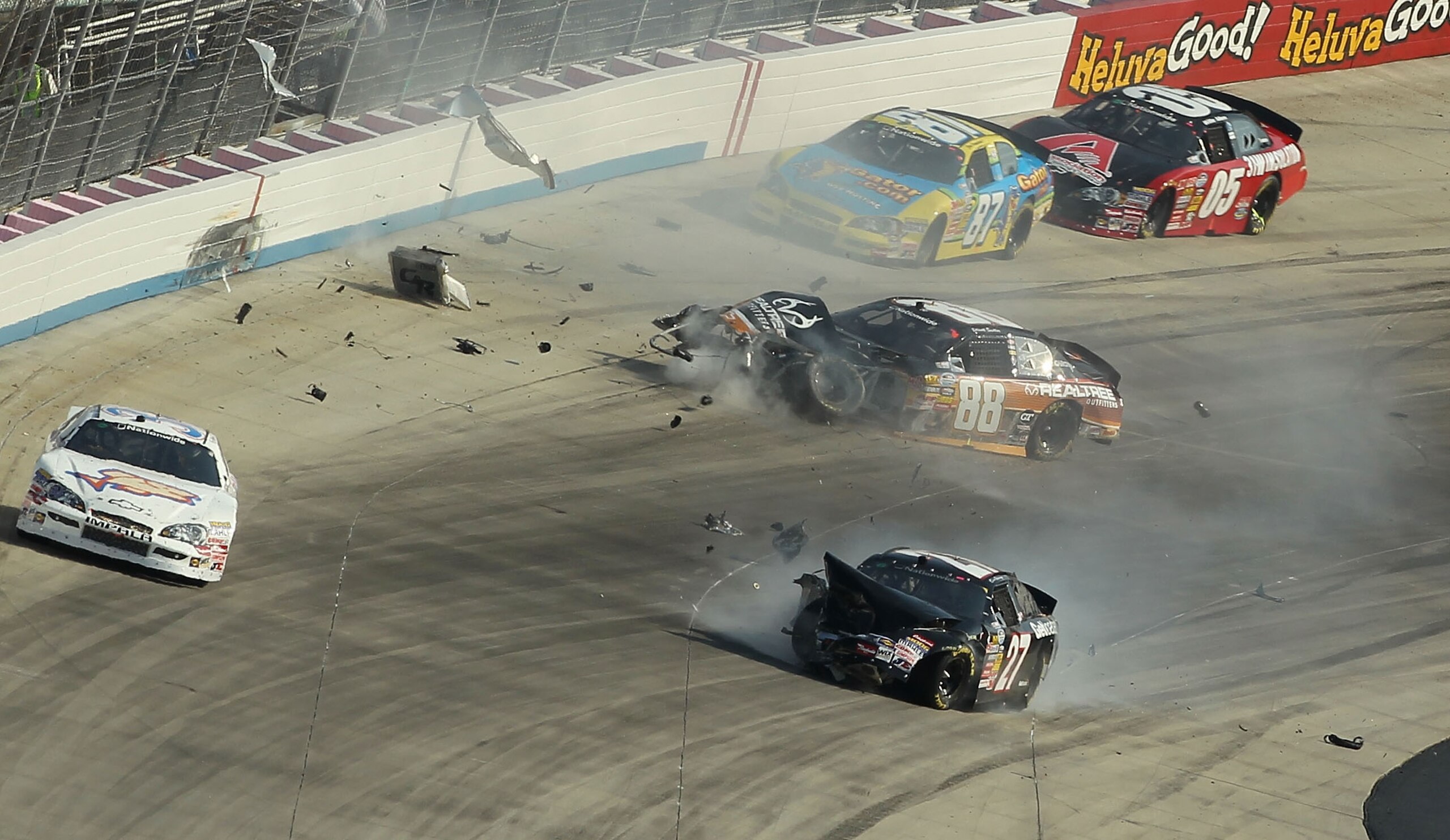DOVER, DE - SEPTEMBER 25:  Elliott Sadler, driver of the #88 Realtree Outfitters Chevrolet, crashes after an incident in the NASCAR Nationwide Series Dover 200 at Dover International Speedway on September 25, 2010 in Dover, Delaware.  (Photo by Nick Laham