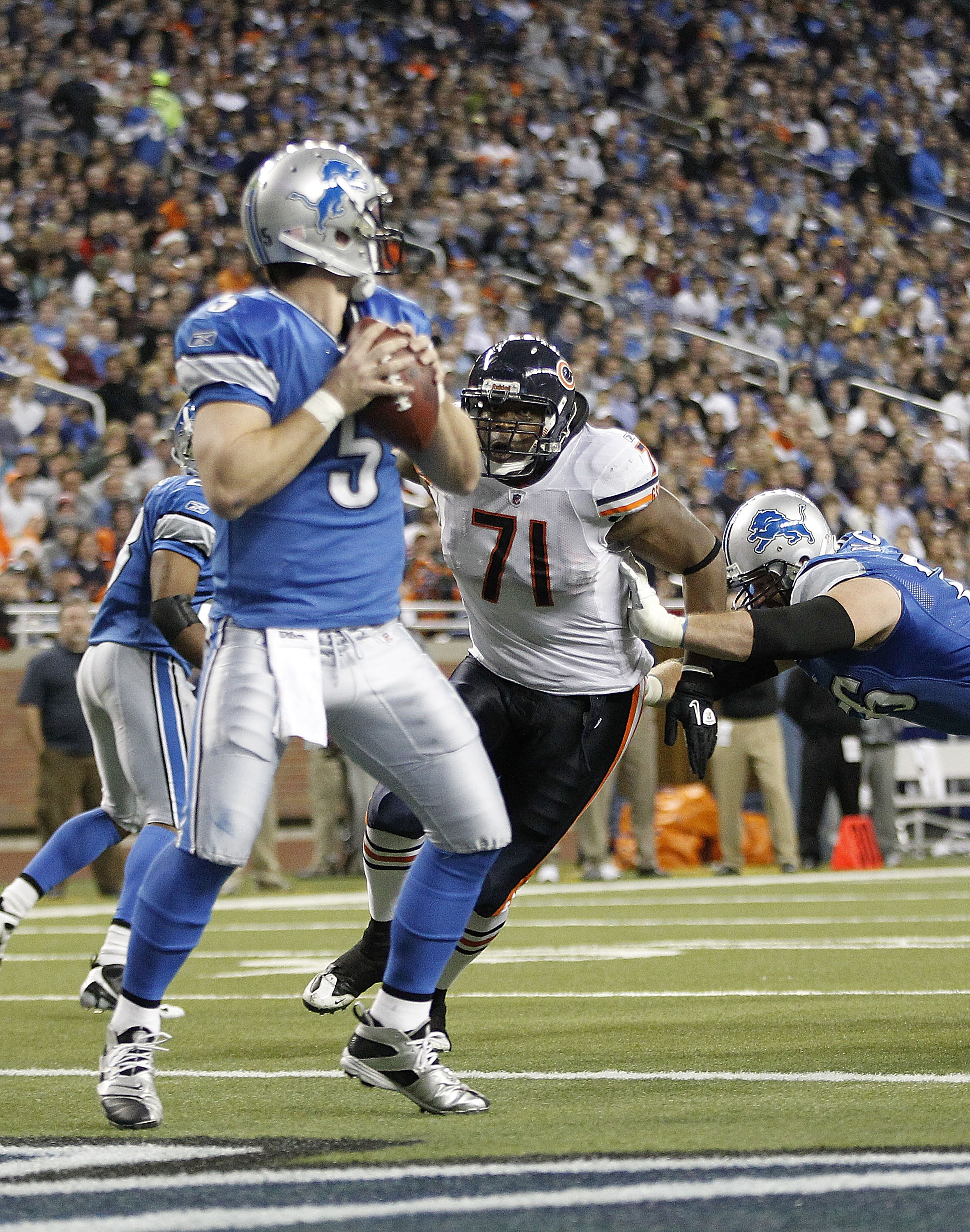 DETROIT - DECEMBER 05: Israel Idonije #71 of the Chicago Bears puts the rush on Drew Stanton #5 of the Detroit Lions during the third quarter of the game at Ford Field on December 5, 2010 in Detroit, Michigan. The Bears defeated the Lions 24-20.  (Photo b