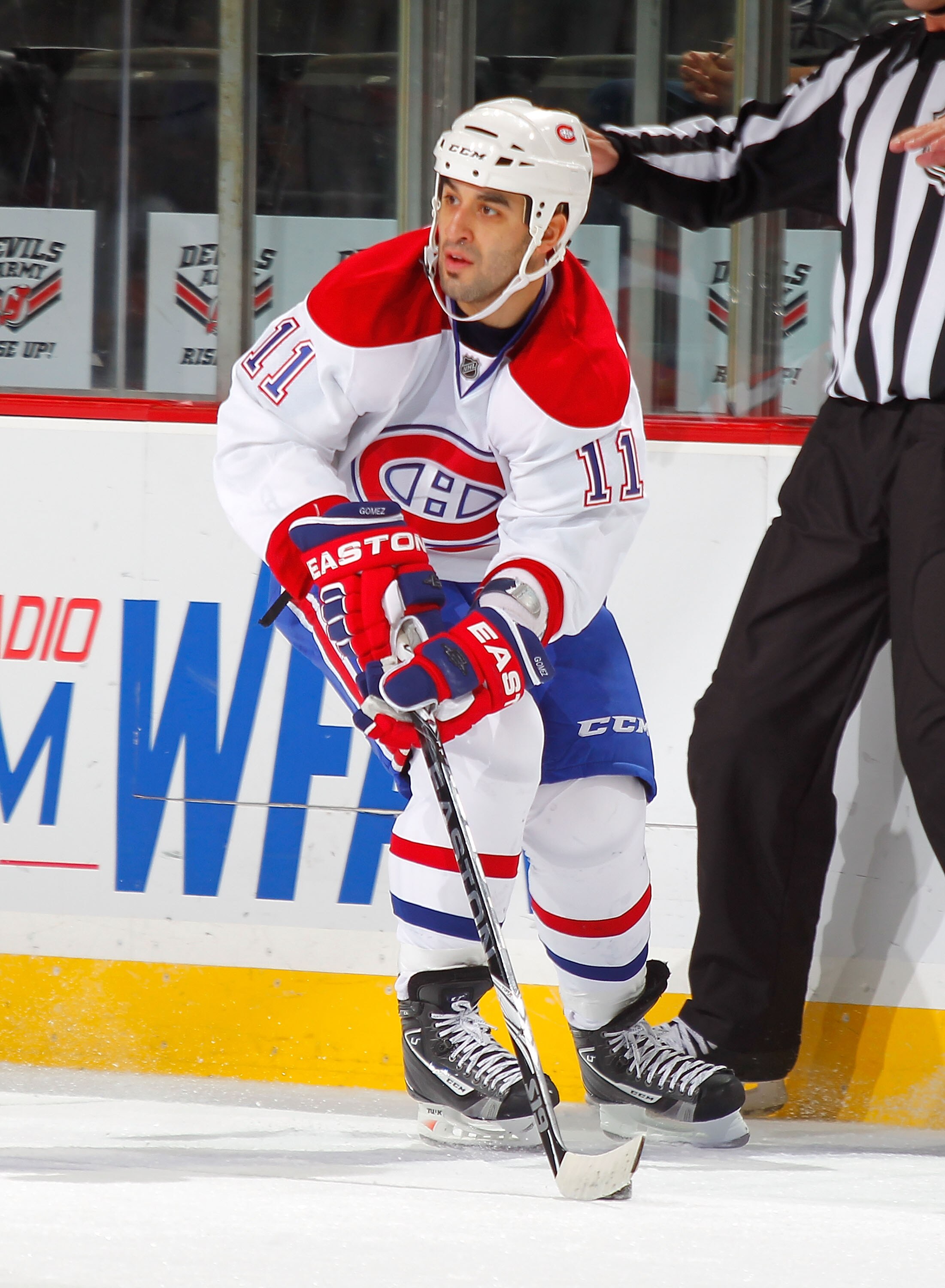 NEWARK, NJ - DECEMBER 02:  Scott Gomez #11 of the Montreal Canadiens skates during a hockey game against the New Jersey Devils at the Prudential Center on December 2, 2010 in Newark, New Jersey. The Canadiens won 5-1. (Photo by Paul Bereswill/Getty Images