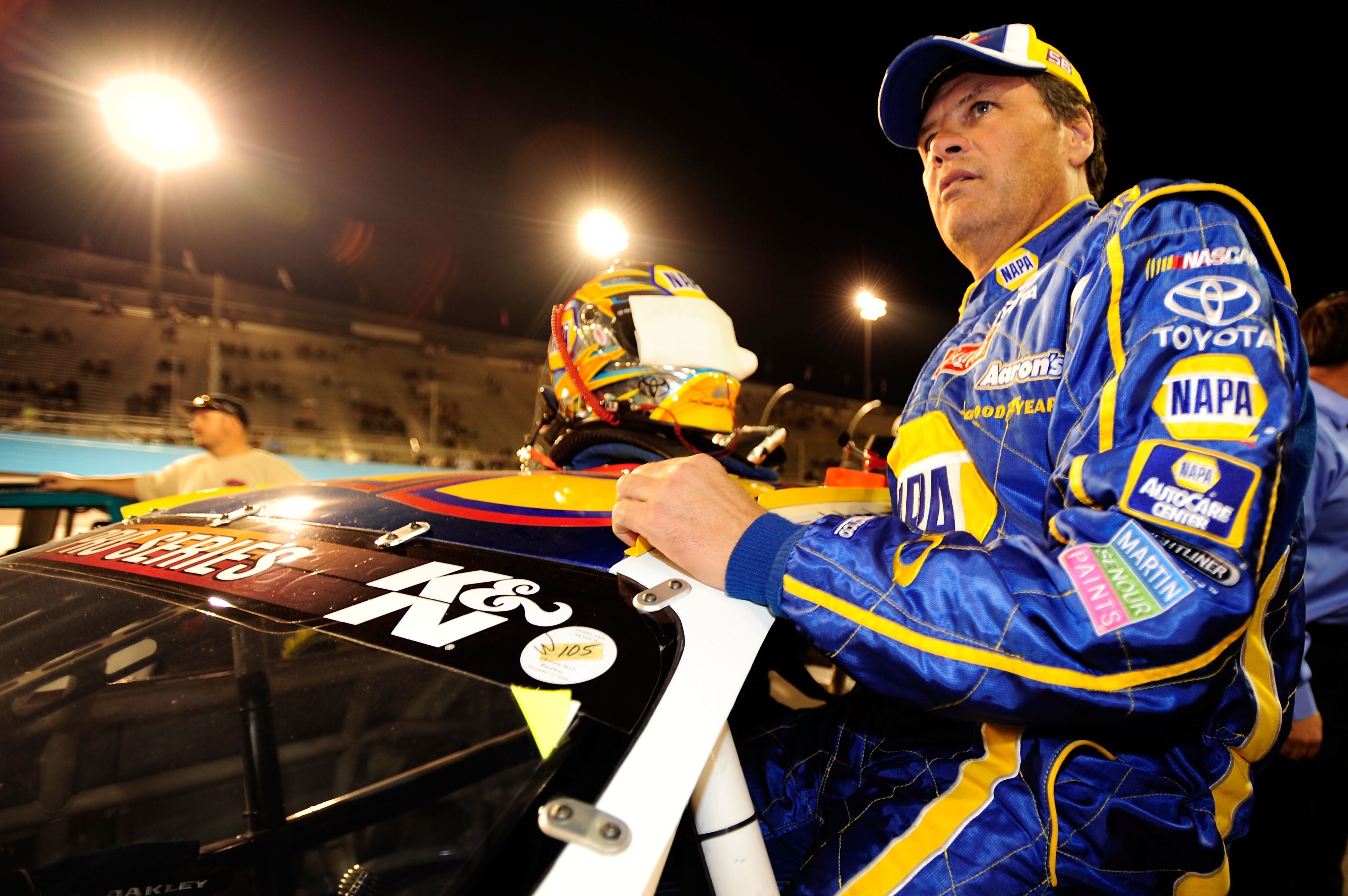 AVONDALE, AZ - NOVEMBER 13:  Michael Waltrip #55 climbs in to his car prior to the NASCAR K&N Pro Series 3 Amigos Tequila 125 at Phoenix International Raceway on November 13, 2010 in Avondale, Arizona.  (Photo by Robert Laberge/Getty Images for NASCAR)
