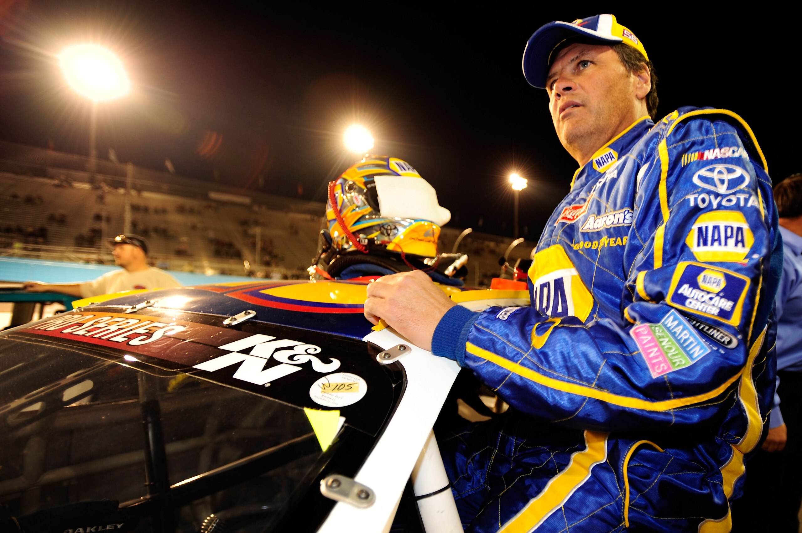 AVONDALE, AZ - NOVEMBER 13:  Michael Waltrip #55 climbs in to his car prior to the NASCAR K&N Pro Series 3 Amigos Tequila 125 at Phoenix International Raceway on November 13, 2010 in Avondale, Arizona.  (Photo by Robert Laberge/Getty Images for NASCAR)