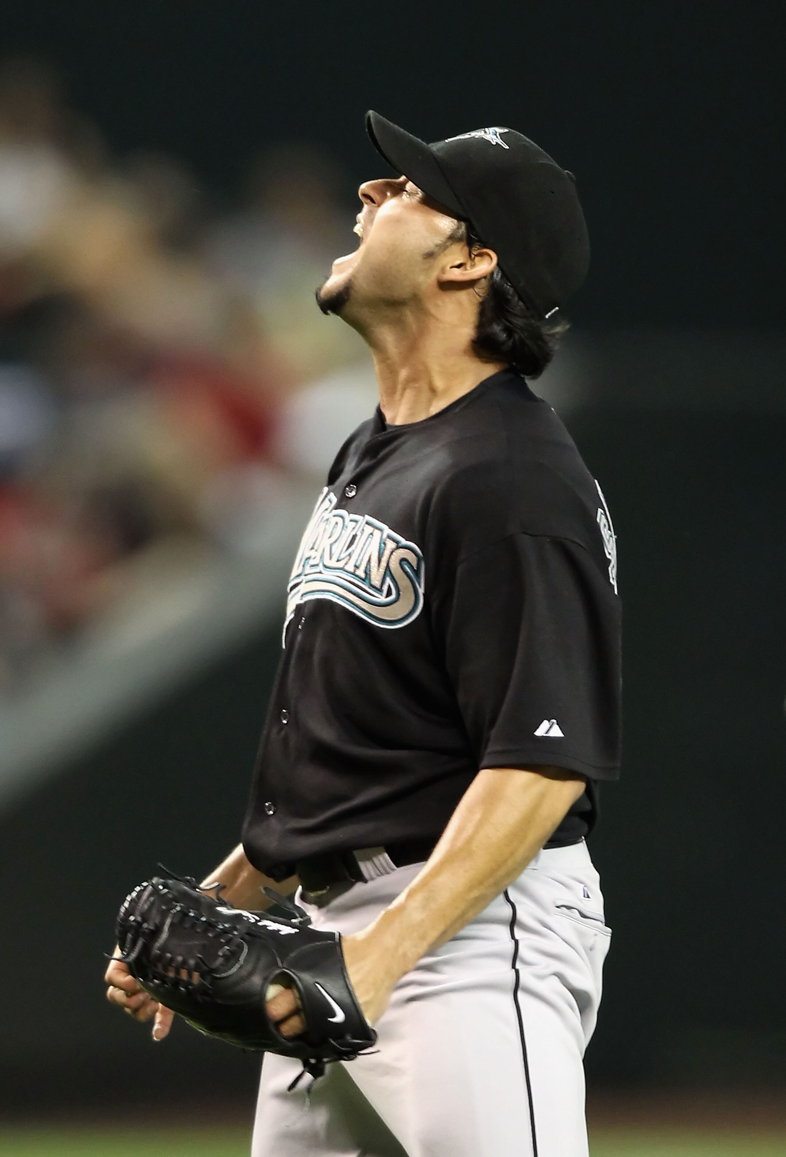 PHOENIX - JULY 08:  Starting pitcher Anibal Sanchez #19 of the Florida Marlins reacts after a committing a fielding error during the fourth inning of the Major League Baseball game against the Arizona Diamondbacks at Chase Field on July 8, 2010 in Phoenix