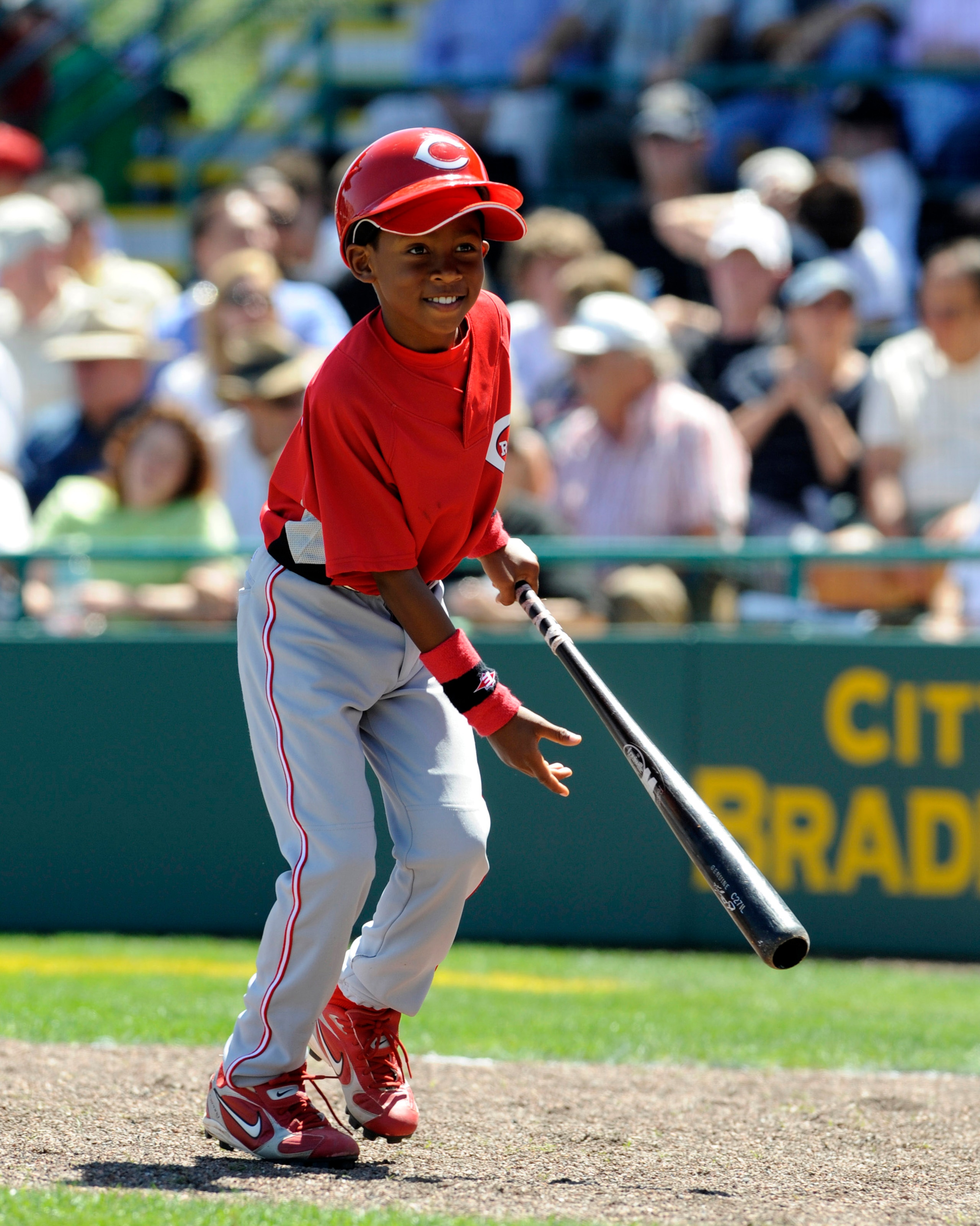 BRADENTON, FL - MARCH 21: Nine-year-old batboy Darren Baker of the Cincinnati Reds retrieves a bat against the Pittsburgh Pirates March 21, 2008 at McKechnie Field in Bradenton, Florida.  Darren is the son of manager Dusty Baker. (Photo by Al Messerschmid