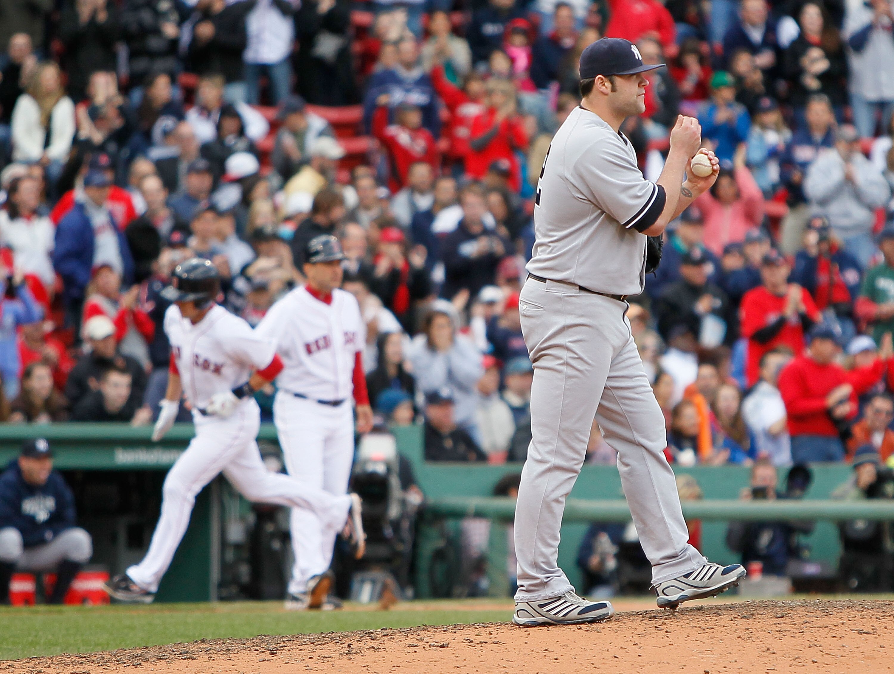 BOSTON - OCTOBER 3:  Jed Lowrie #12 of  the Boston Red Sox rounds the bases after hitting a home run against Joba Chamberlain #62 of the New York Yankees at Fenway Park, October 3, 2010, in Boston, Massachusetts. (Photo by Jim Rogash/Getty Images)