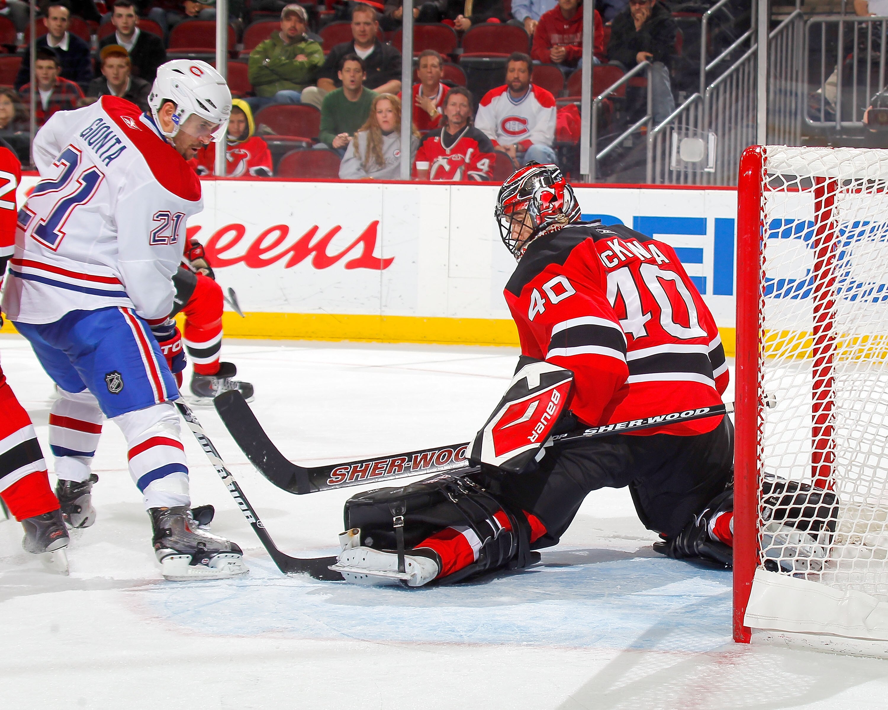NEWARK, NJ - DECEMBER 02:  Brian Gionta #21 of the Montreal Canadiens is stopped by goalie Mike McKenna #40 of the New Jersey Devils during the third period of a hockey game at the Prudential Center on December 2, 2010 in Newark, New Jersey.  (Photo by Pa