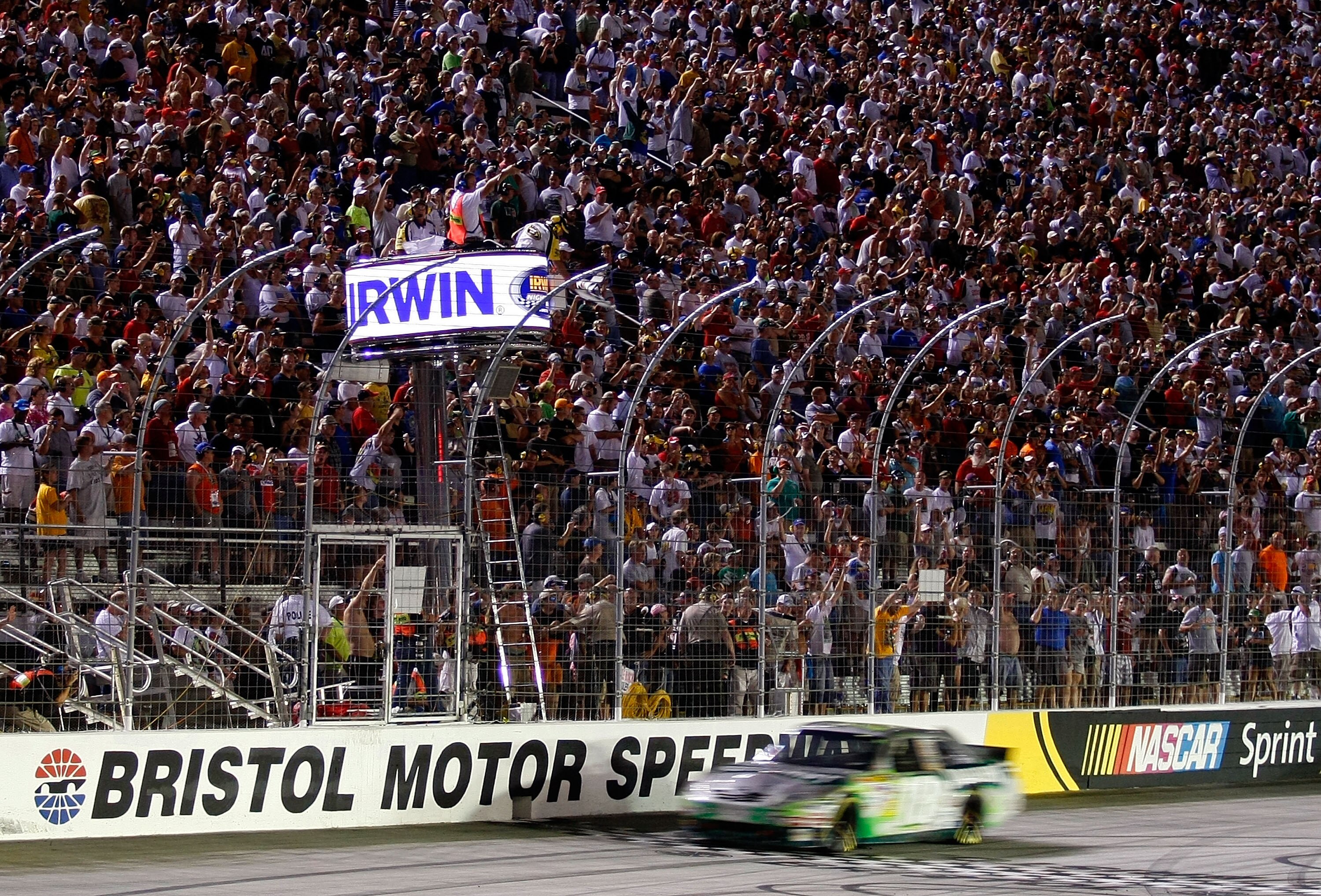 BRISTOL, TN - AUGUST 21:  Kyle Busch, driver of the #18 Doublemint Toyota, crosses the finish line to win the NASCAR Sprint Cup Series IRWIN Tools Night Race at Bristol Motor Speedway on August 21, 2010 in Bristol, Tennessee.  (Photo by Geoff Burke/Getty 