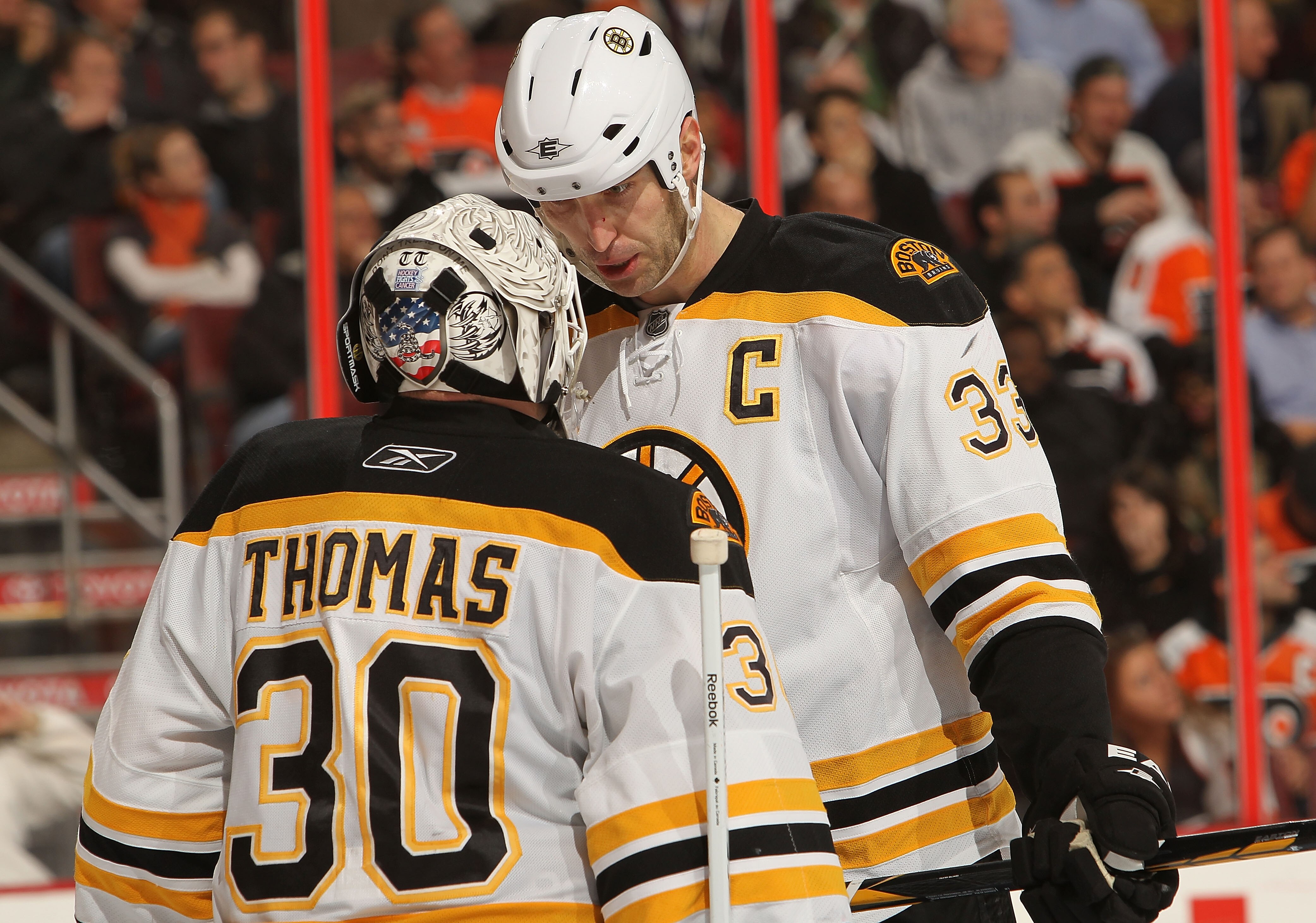 PHILADELPHIA, PA - DECEMBER 01:  Tim Thomas #30 of the Boston Bruins talks with Zdeno Chara #33 against the Philadelphia Flyers at the Wells Fargo Center on December 1, 2010 in Philadelphia, Pennsylvania.  (Photo by Nick Laham/Getty Images)