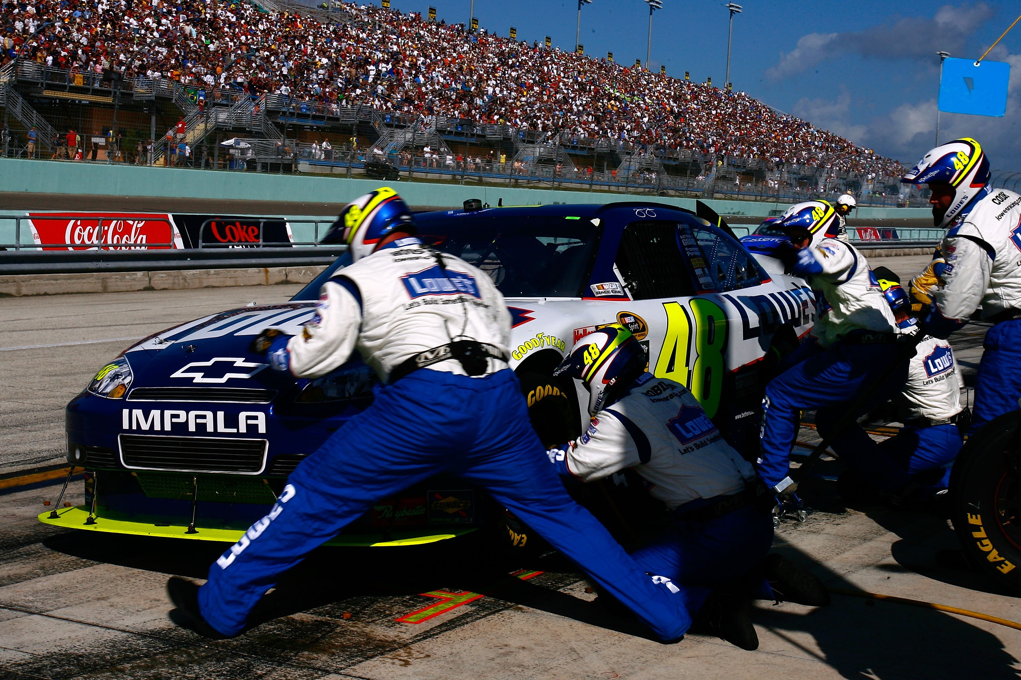 HOMESTEAD, FL - NOVEMBER 21:  Jimmie Johnson, driver of the #48 Lowe's Chevrolet,  makes a pit stop during the NASCAR Sprint Cup Series Ford 400 at Homestead-Miami Speedway on November 21, 2010 in Homestead, Florida.  (Photo by Jason Smith/Getty Images fo