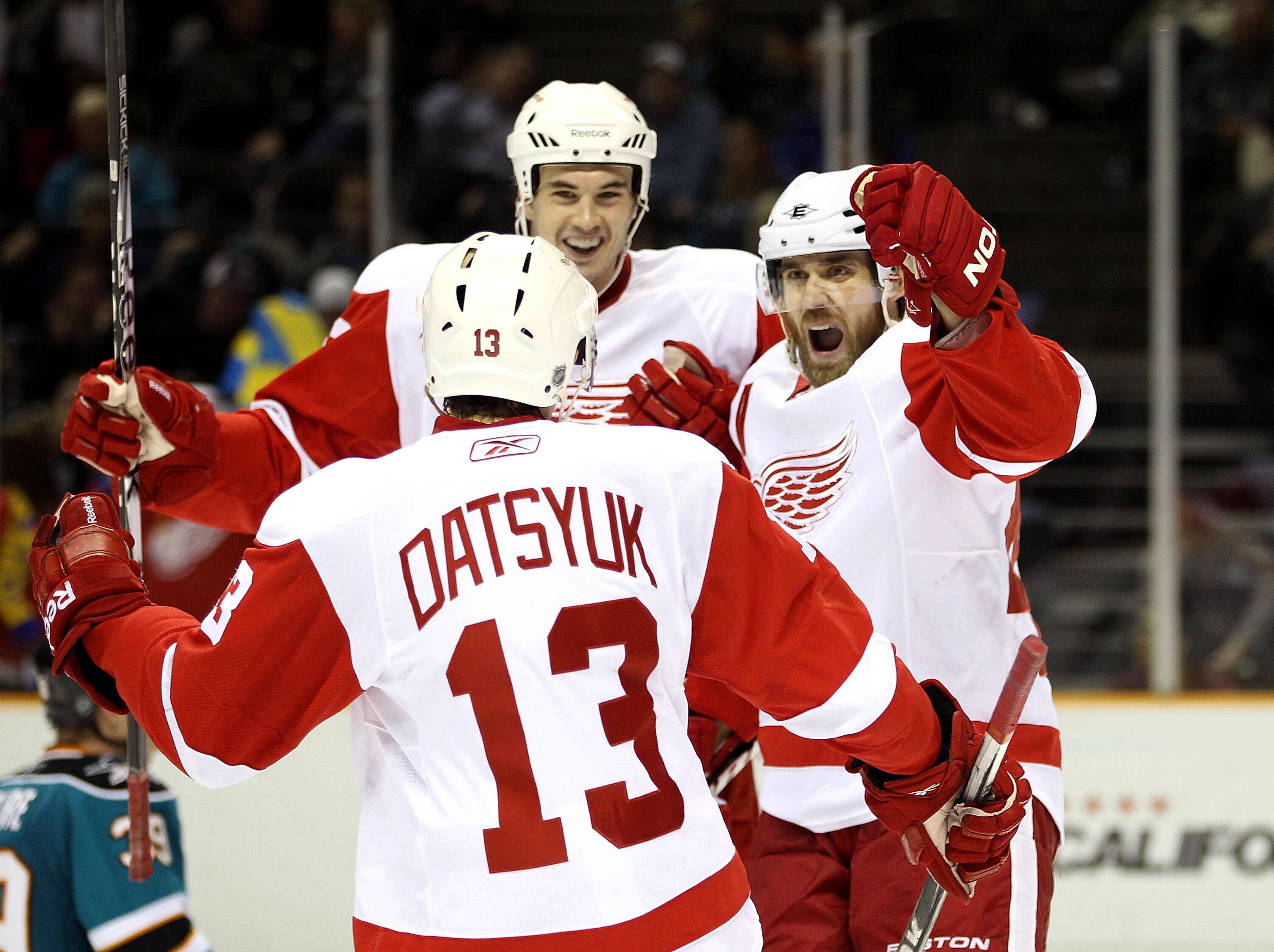 SAN JOSE, CA - NOVEMBER 30:  Henrik Zetterberg #40 celebrates with Pavel Datsyuk #13 and Jonathan Ericsson #52 of the Detroit Red Wings after Zetterberg scored a goal against the San Jose Sharks at HP Pavilion on November 30, 2010 in San Jose, California.
