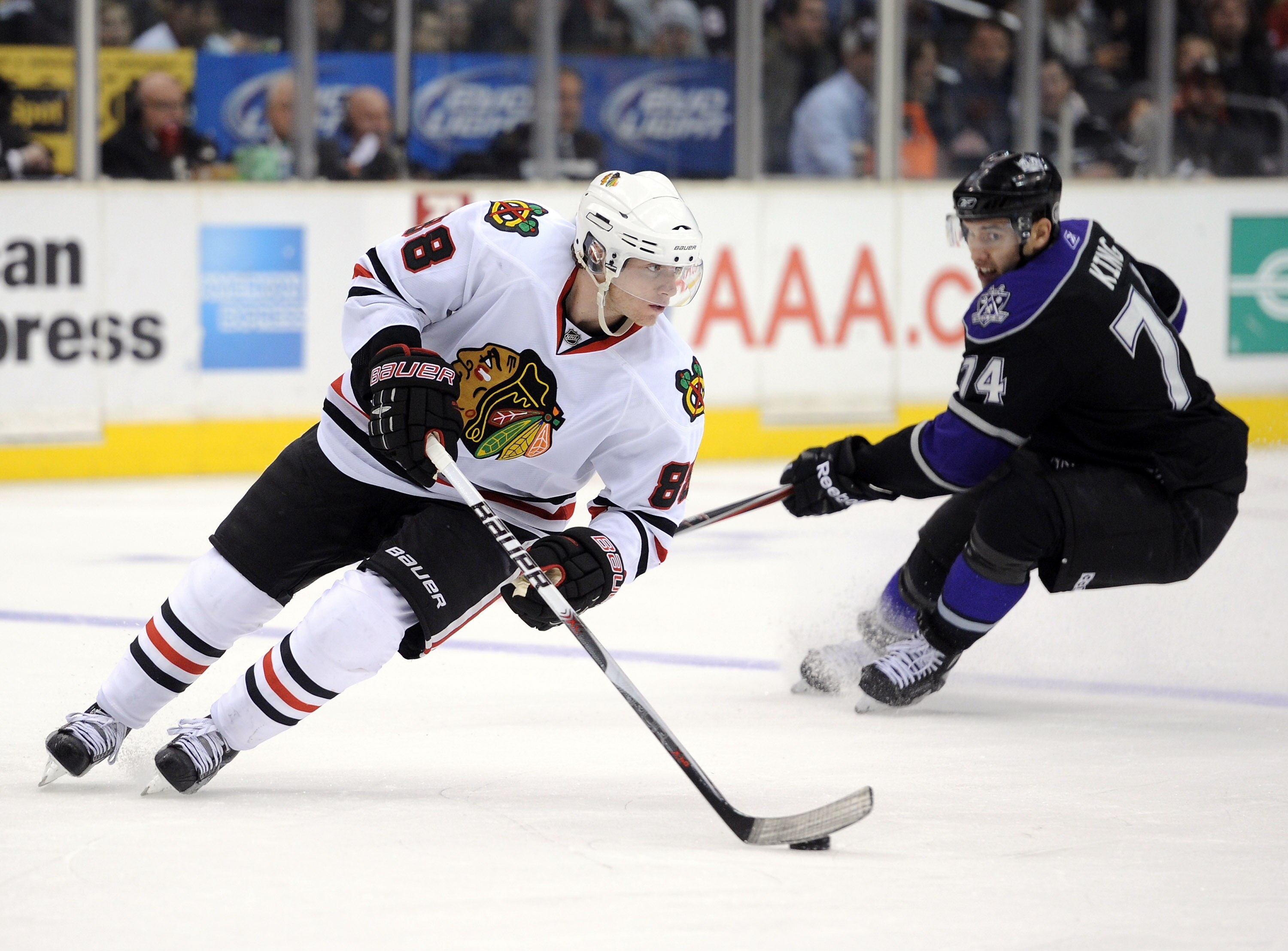 LOS ANGELES, CA - NOVEMBER 27:  Patrick Kane #88 of the Chicago Blackhawks turns away from Justin Willilams #14 of the Los Angeles Kings at Staples Center on November 27, 2010 in Los Angeles, California.  (Photo by Harry How/Getty Images)