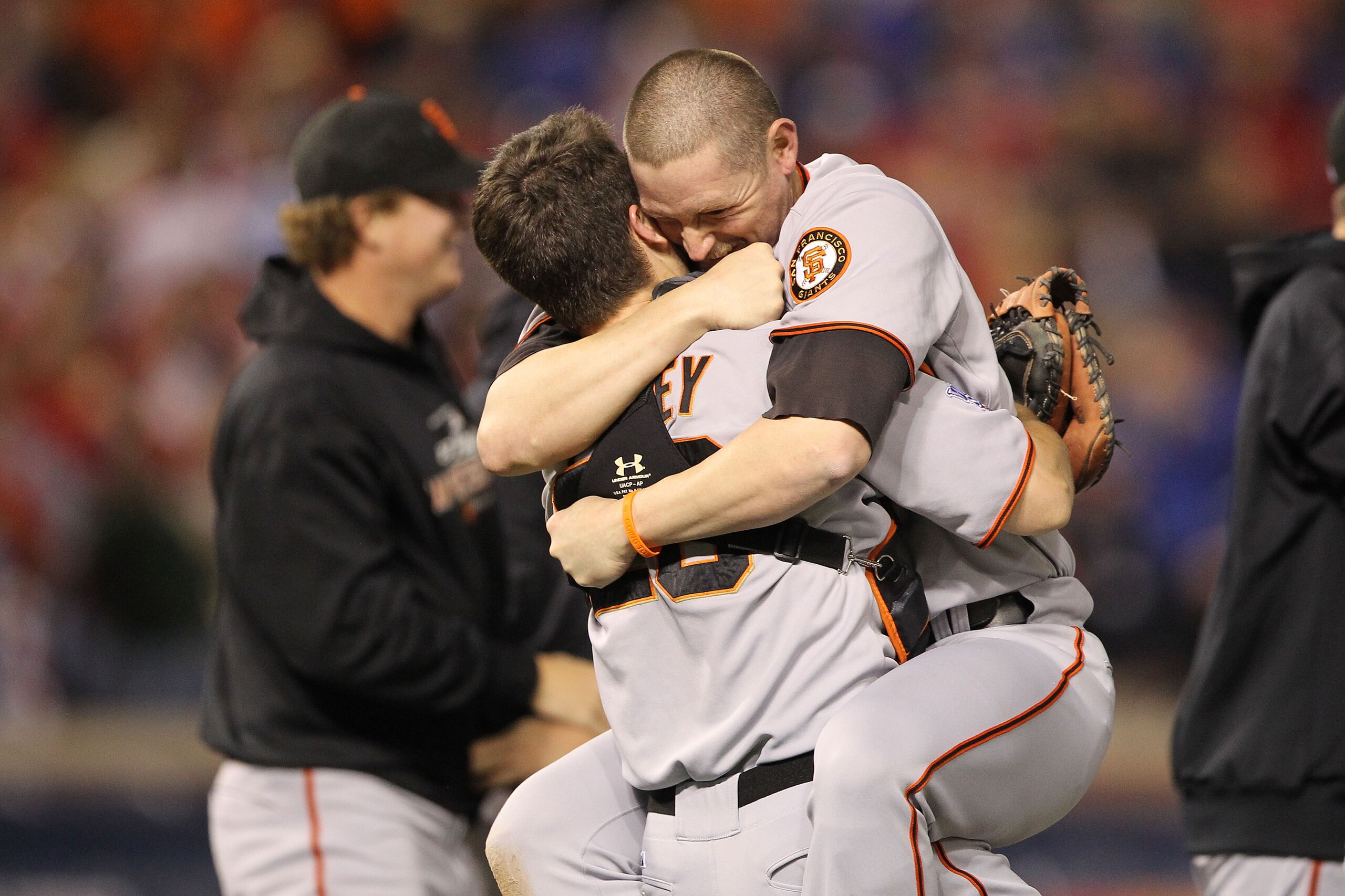 ARLINGTON, TX - NOVEMBER 01:  Buster Posey #28 hugs Aubrey Huff #17 (R) of the San Francisco Giants celebrate their 3-1 victory to win the World Series over the Texas Rangers in Game Five of the 2010 MLB World Series at Rangers Ballpark in Arlington on No