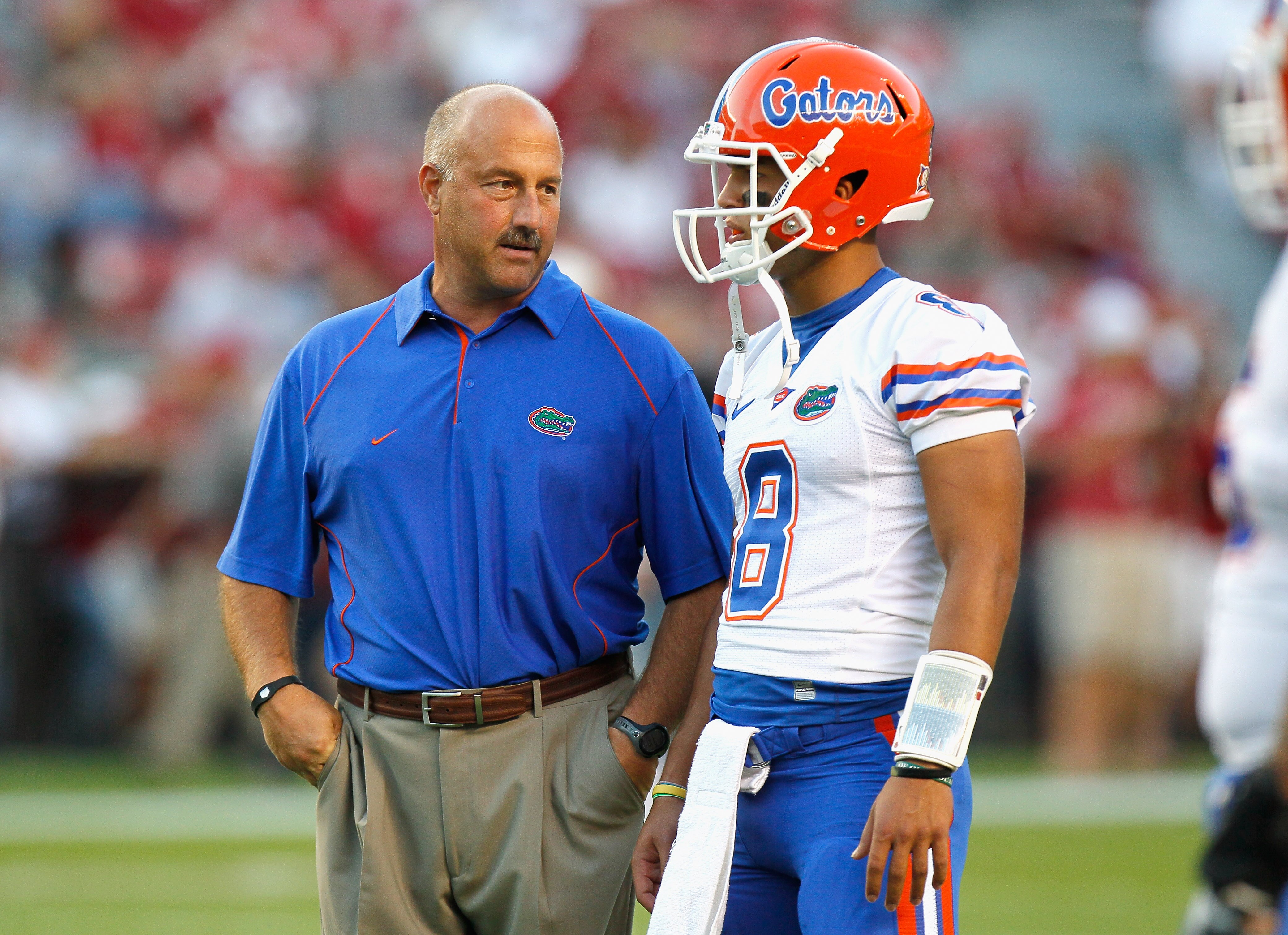 TUSCALOOSA, AL - OCTOBER 02:  Offensive coordinator Steve Addazio converses with quarterback Trey Burton #8 of the Florida Gators during pregame warmups before facing the Alabama Crimson Tide at Bryant-Denny Stadium on October 2, 2010 in Tuscaloosa, Alaba
