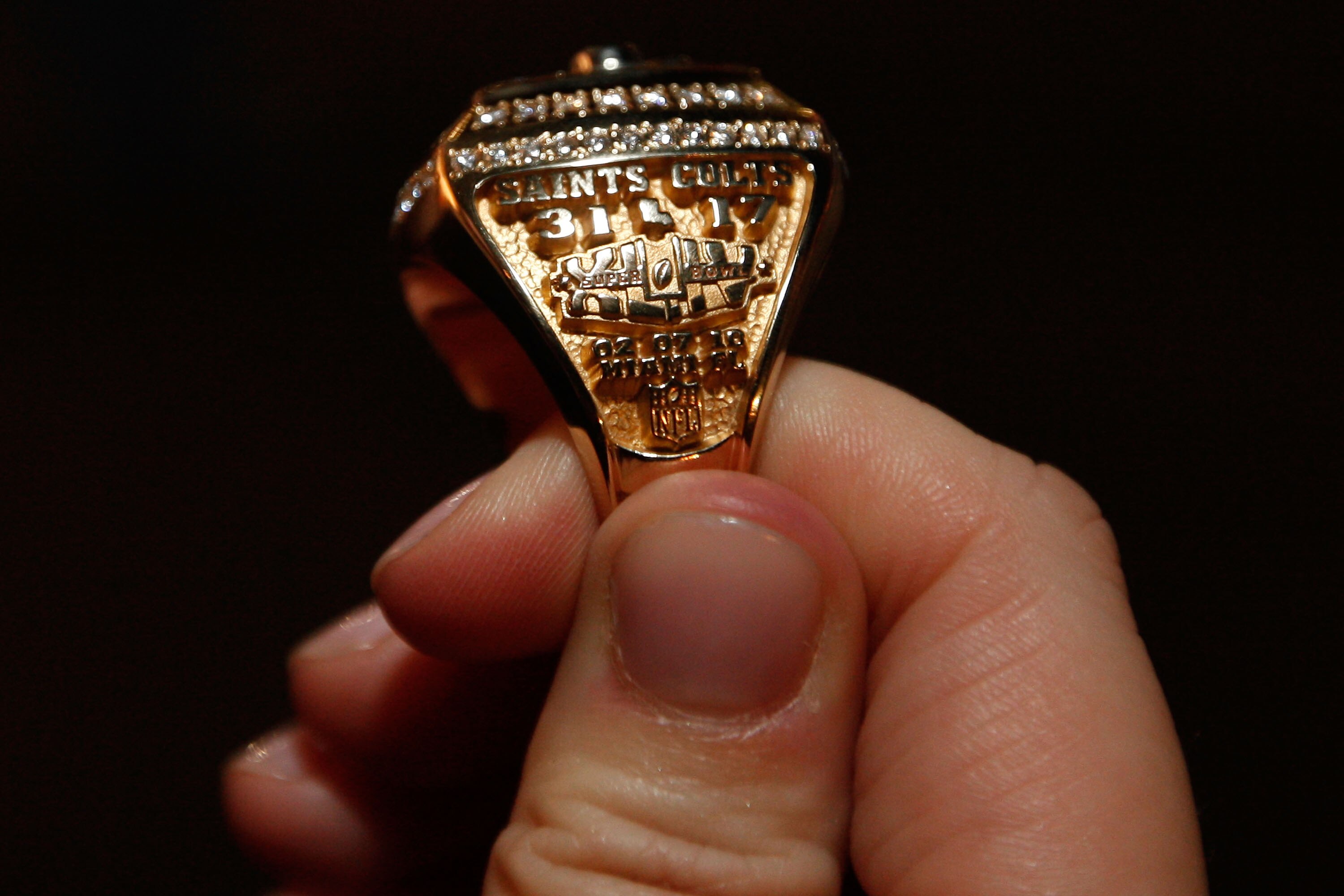 NEW ORLEANS - JUNE 16:  A member of the New Orleans Saints shows off their ring from Super Bowl XLIV on June 16, 2010 in New Orleans, Louisiana.  (Photo by Chris Graythen/Getty Images)
