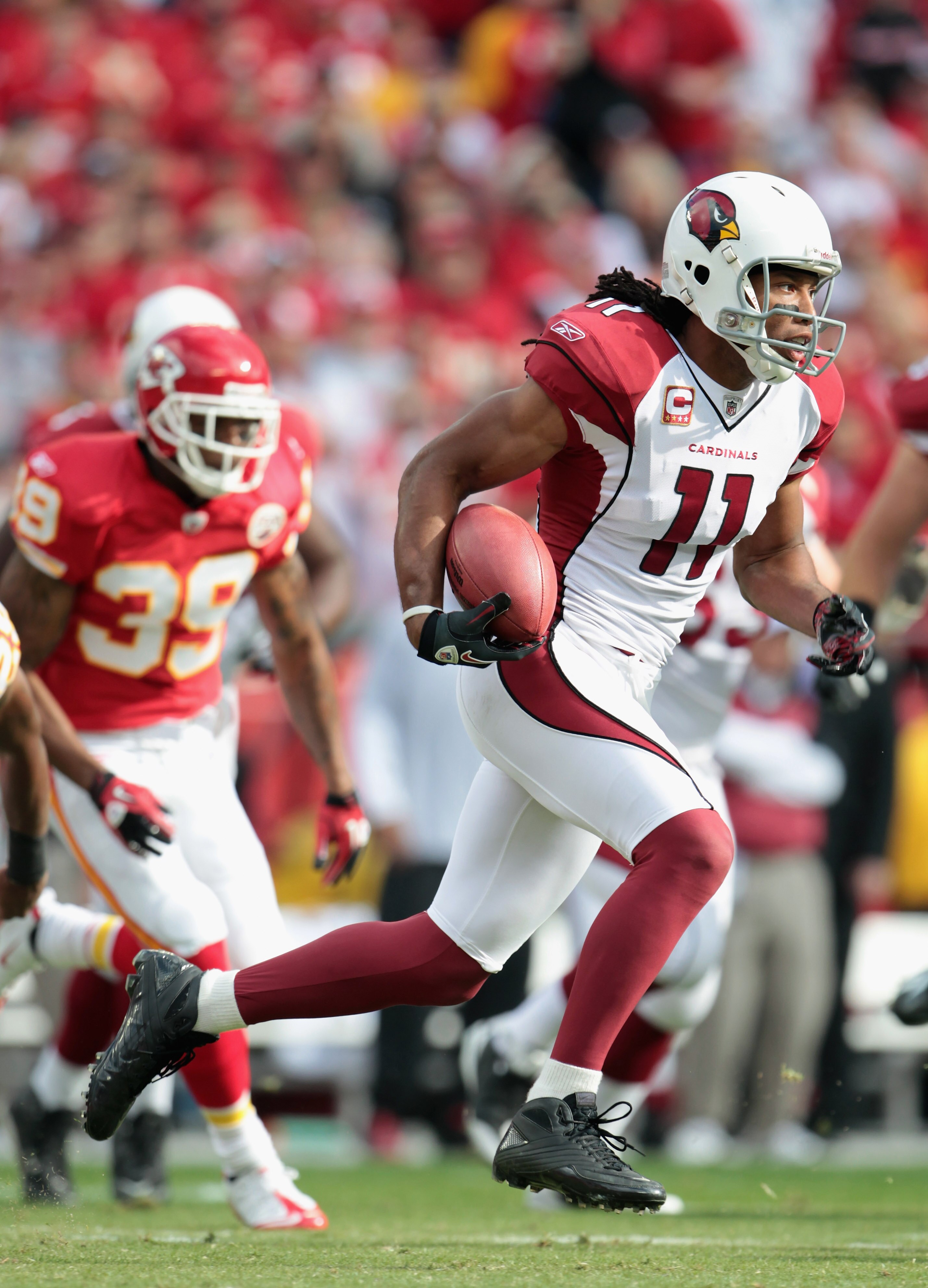 KANSAS CITY, MO - NOVEMBER 21:  Larry Fitzgerald #11 of the Arizona Cardinals carries the ball during the game against the Kansas City Chiefs on November 21, 2010 at Arrowhead Stadium in Kansas City, Missouri.  (Photo by Jamie Squire/Getty Images)