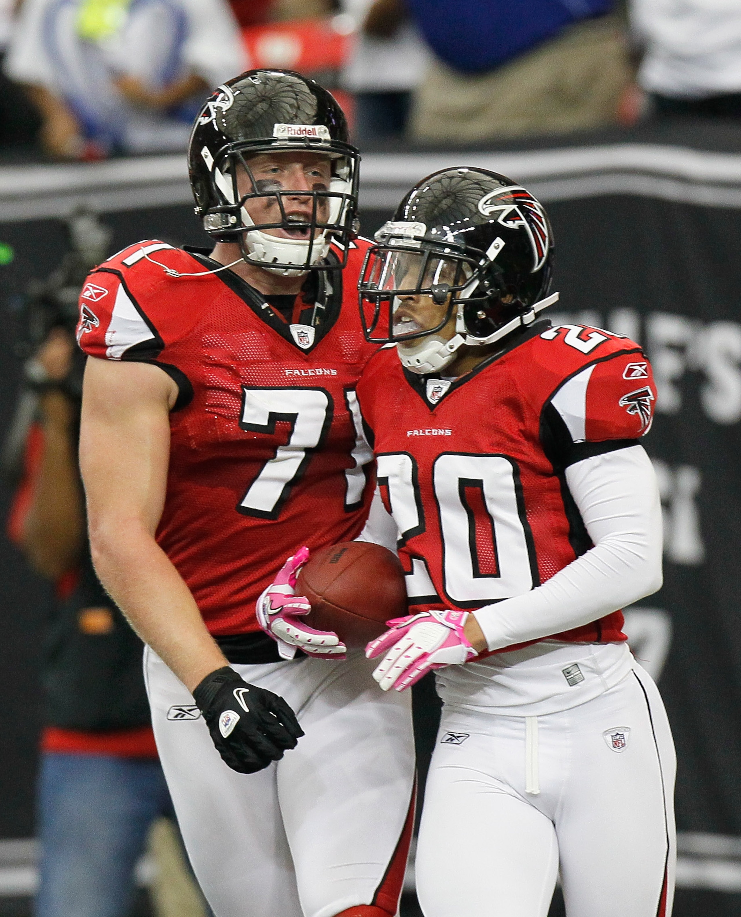 ATLANTA - OCTOBER 24:  Brent Grimes #20 and Kroy Biermann #71 of the Atlanta Falcons against the Cincinnati Bengals at Georgia Dome on October 24, 2010 in Atlanta, Georgia.  (Photo by Kevin C. Cox/Getty Images)