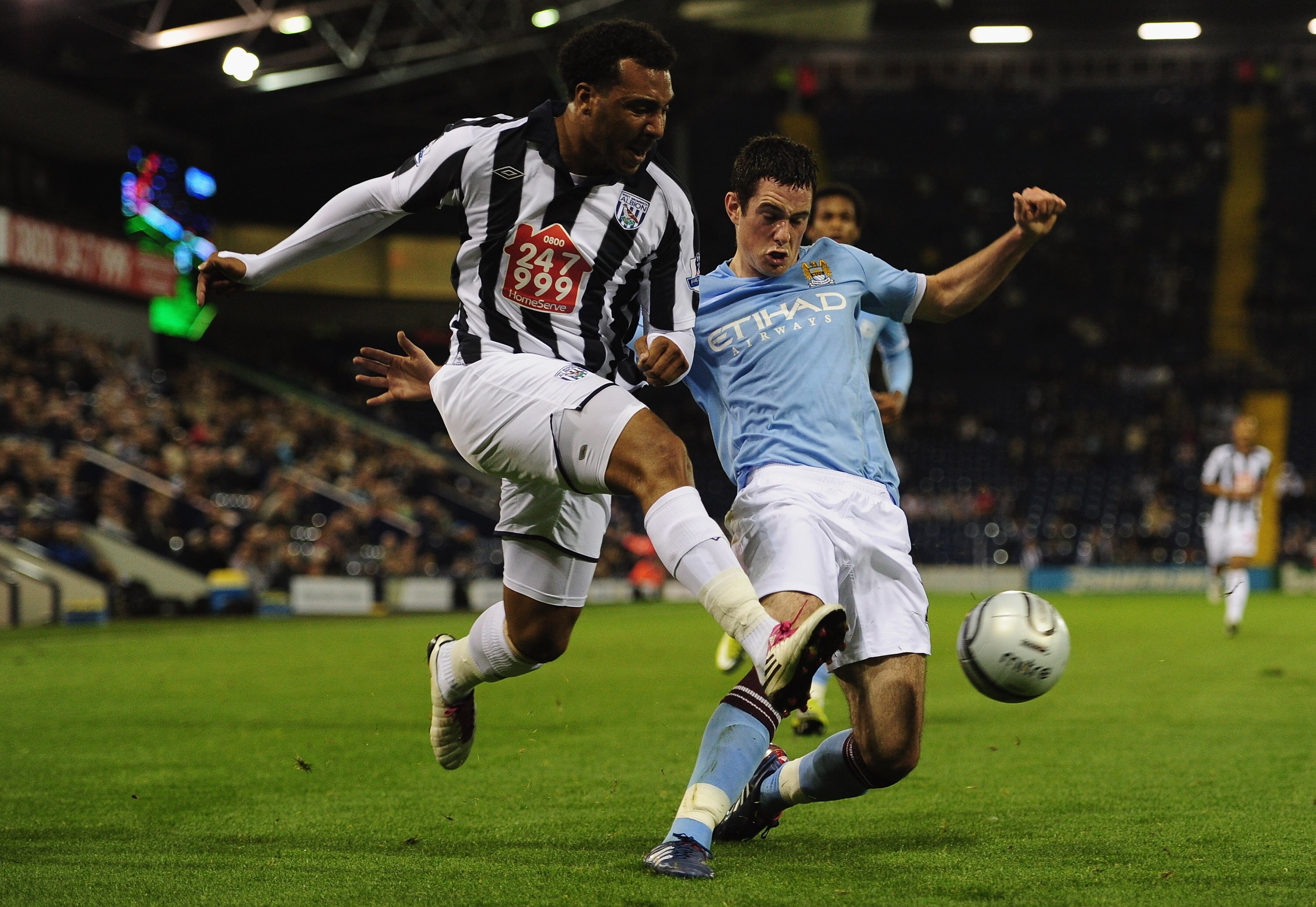 WEST BROMWICH, ENGLAND - SEPTEMBER 22:  Greg Cunningham of Manchester City tackles Giles Barnes of West Bromwich Albion attempts a shot on goal during the Carling Cup 3rd Round match between West Bromwich Albion and Manchester City at The Hawthorns on Sep