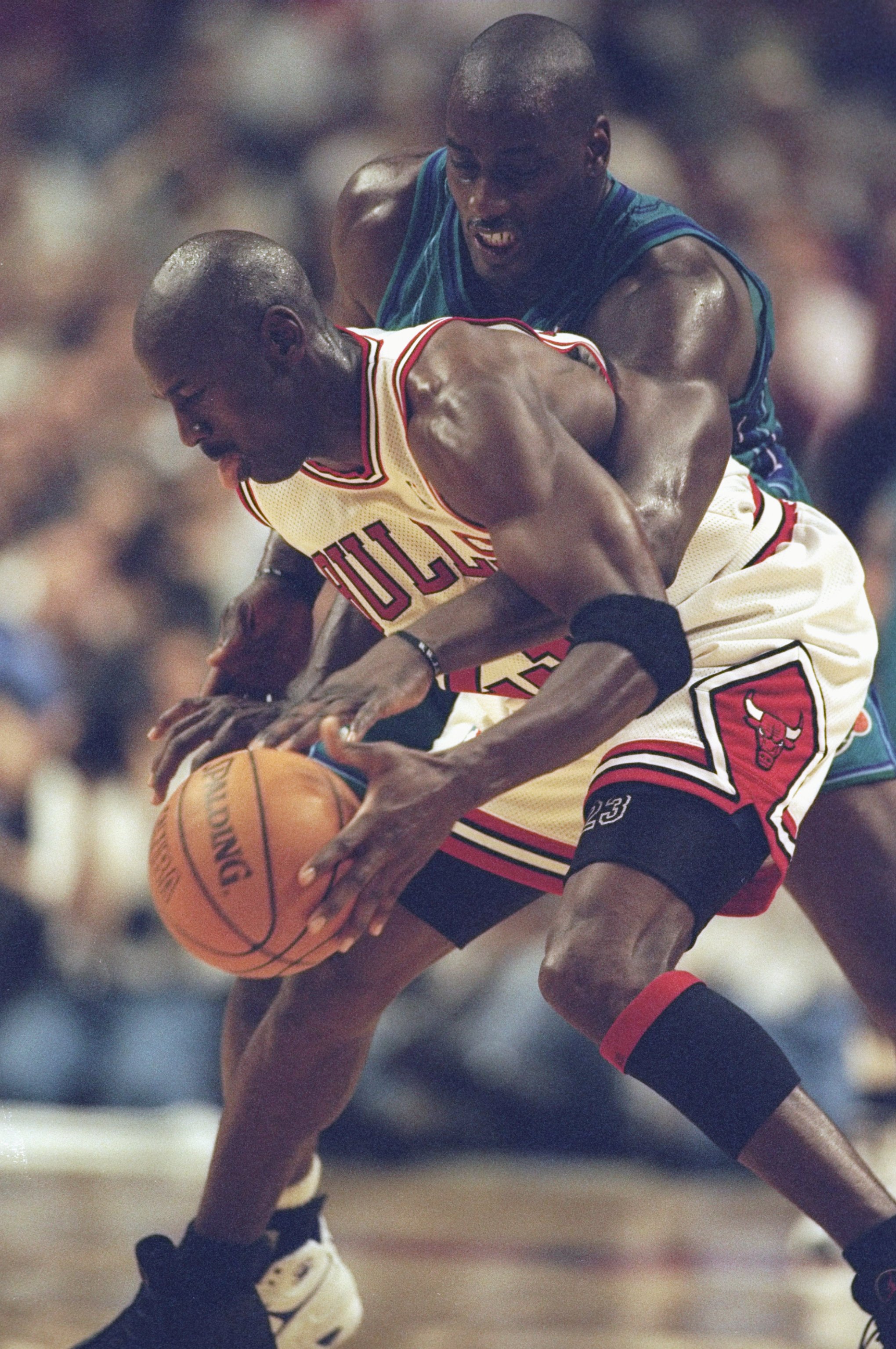 13 May 1998: Michael Jordan #23 of the Chicago Bulls if covered by Anthony Mason of the Charlotte Hornets at the United Center in Chicago, Illinios. The Bulls defeated the Hornets 93-84. Mandatory Credit: Jonathan Daniel  /Allsport