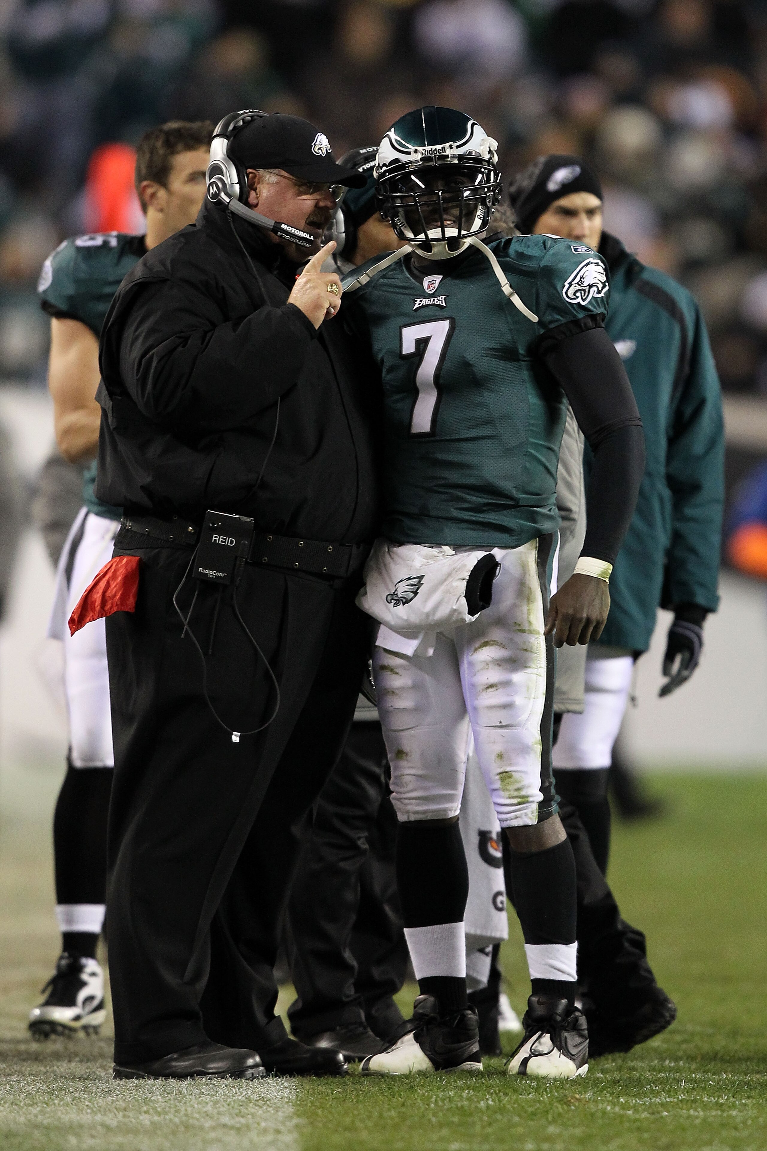 PHILADELPHIA, PA - DECEMBER 02:  Head coach Andy Reid and Michael Vick #7 of the Philadelphia Eagles talk on the sideline against the Houston Texans at Lincoln Financial Field on December 2, 2010 in Philadelphia, Pennsylvania.  (Photo by Al Bello/Getty Im