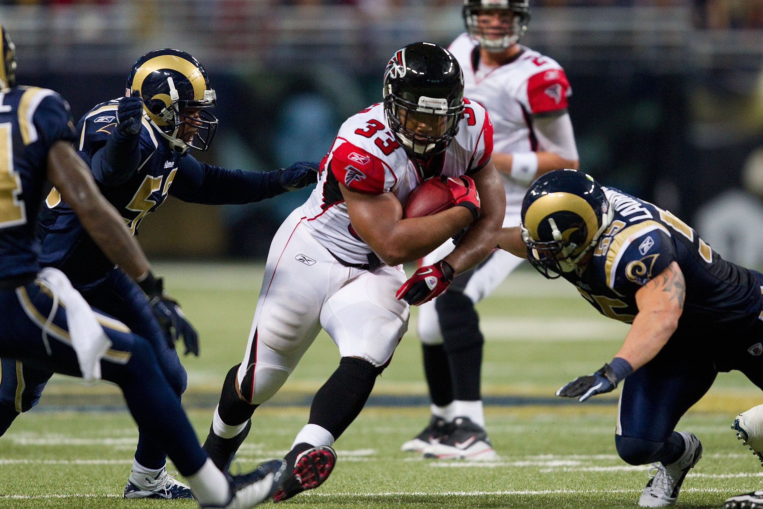 ST. LOUIS - NOVEMBER 21: Michael Turner #33 of the Atlanta Falcons rushes against the St. Louis Rams at the Edward Jones Dome on November 21, 2010 in St. Louis, Missouri.  The Falcons beat the Rams 34-17.  (Photo by Dilip Vishwanat/Getty Images)