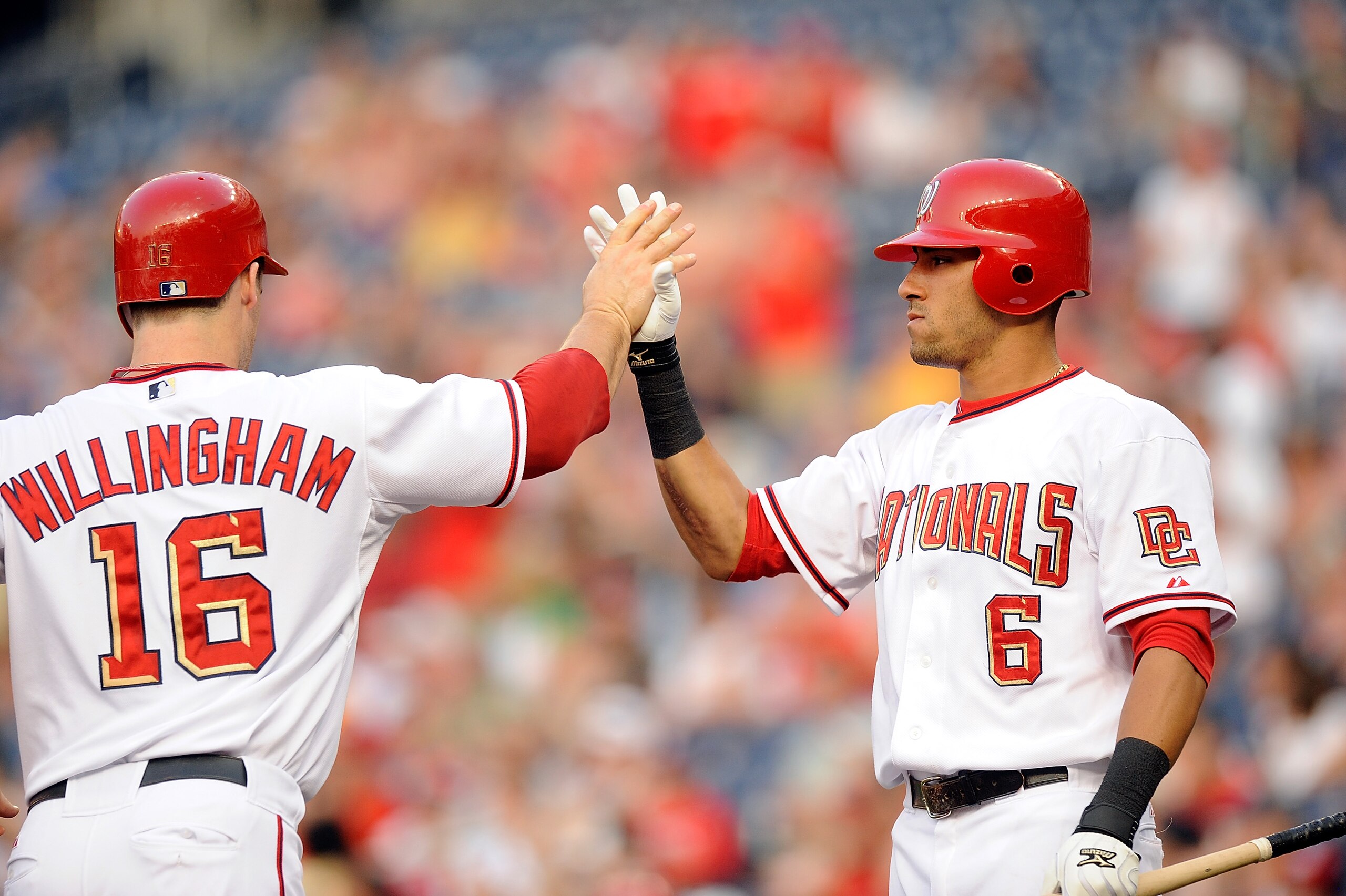 WASHINGTON - JULY 06:  Josh Willingham #16 of the Washington Nationals is congratulated by Ian Desmond #6 after scoring in the first inning against the San Diego Padres at Nationals Park on July 6, 2010 in Washington, DC.  (Photo by Greg Fiume/Getty Image