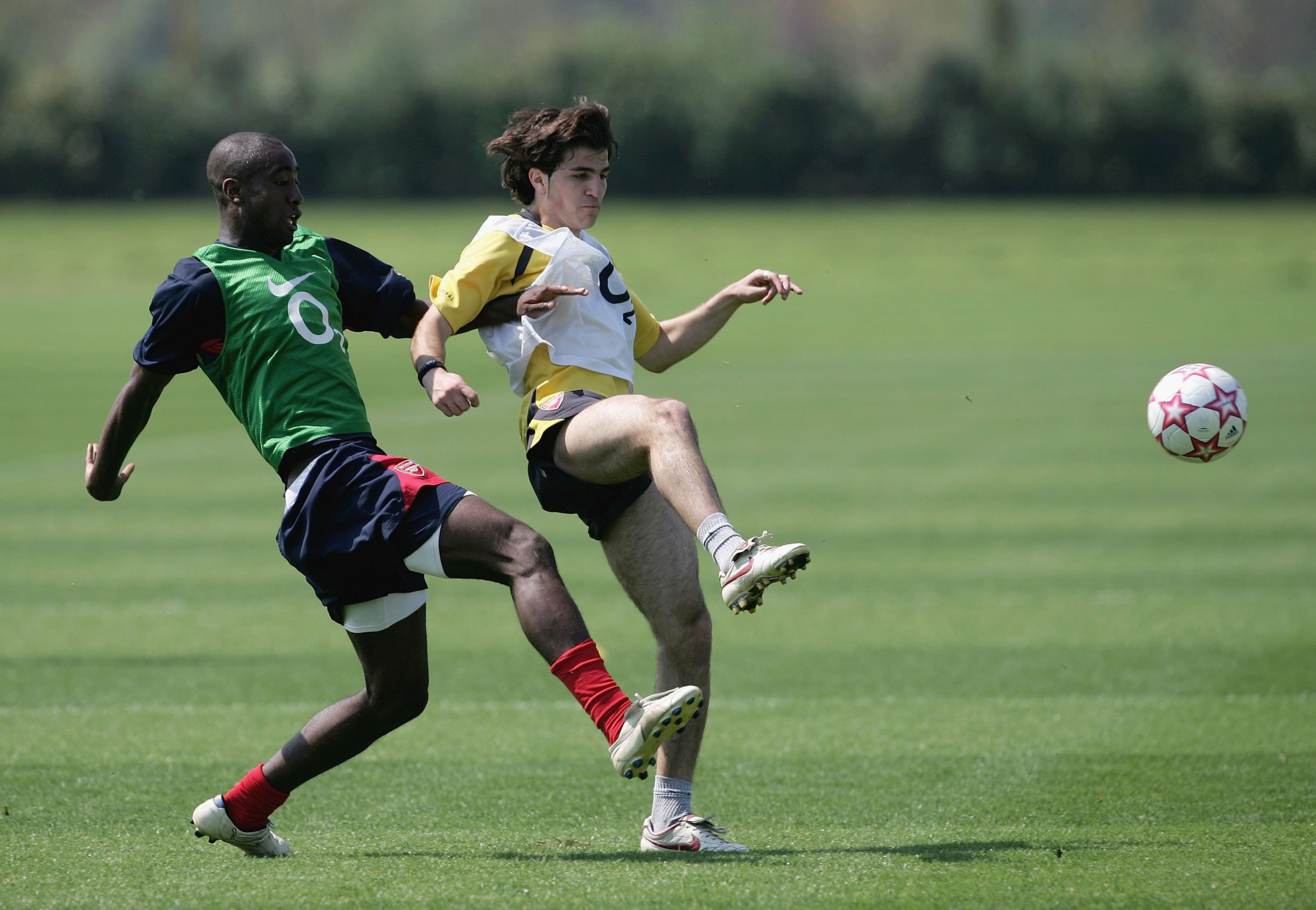 LONDON COLNEY, UNITED KINGDOM - MAY 11:  Johan Djourou challenges Cesc Fabregas during the Arsenal UEFA Champions League Media Day at the Arsenal Training Complex on May 11. 2006 in London Colney, England. Arsenal will take on Barcelona in the UEFA Champi
