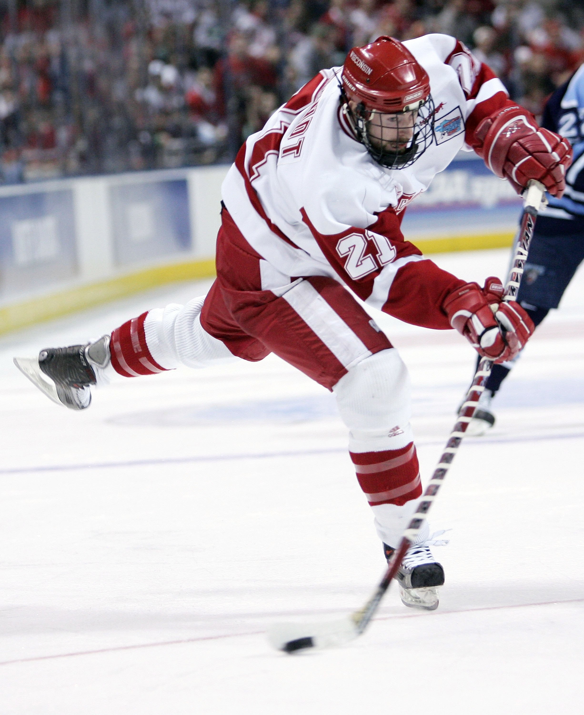 MILWAUKEE - APRIL 06:  Andy Brandt #21 of the Wisconsin Badgers takes a shot against the Maine Black Bears during the NCAA Frozen Four on April 6, 2006 at the Bradley Center in Milwaukee, Wisconsin.  (Photo by Elsa/Getty Images)