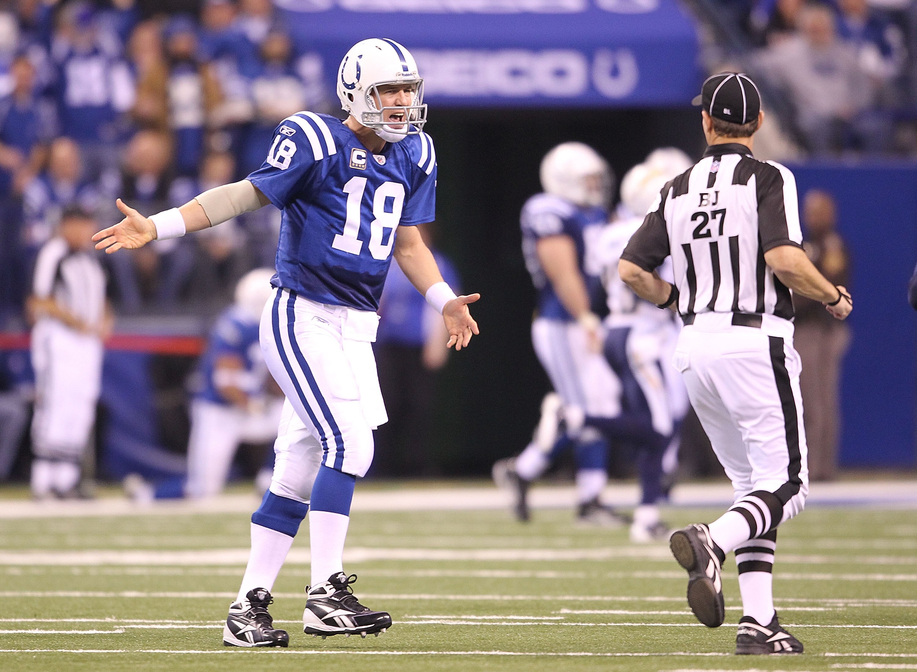INDIANAPOLIS - NOVEMBER 28:  Peyton Manning #18 of the Indianapolis Colts complains to a game offical after throwing an interception that was returned for a touchdown during the NFL game against the San Diego Chargers at Lucas Oil Stadium on November 28,
